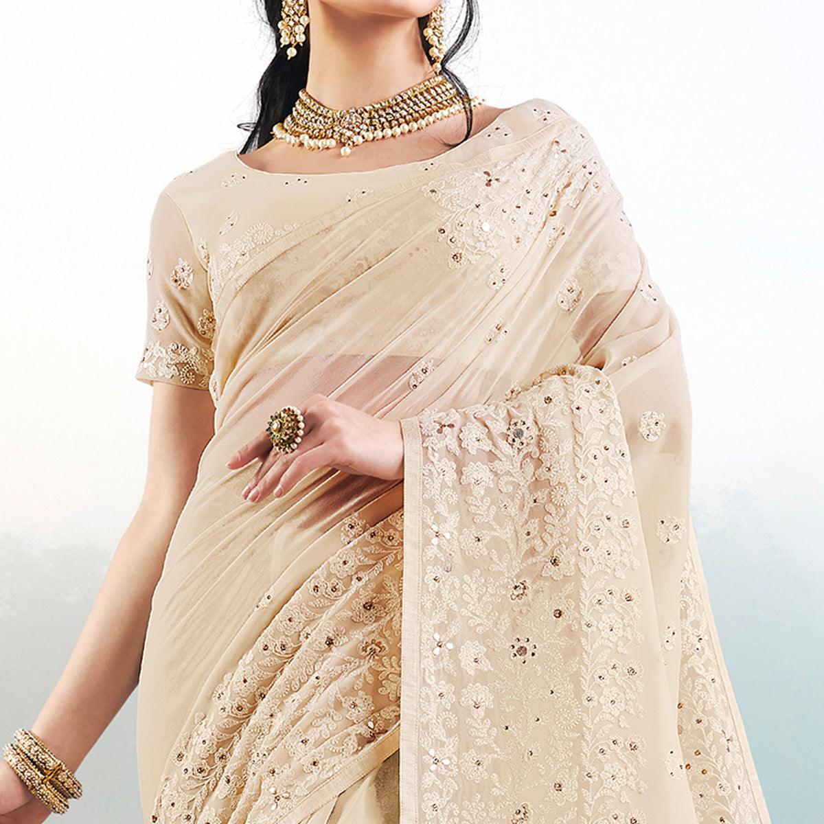 Demanding Beige Colored Partywear Embroidered Georgette Saree - Peachmode