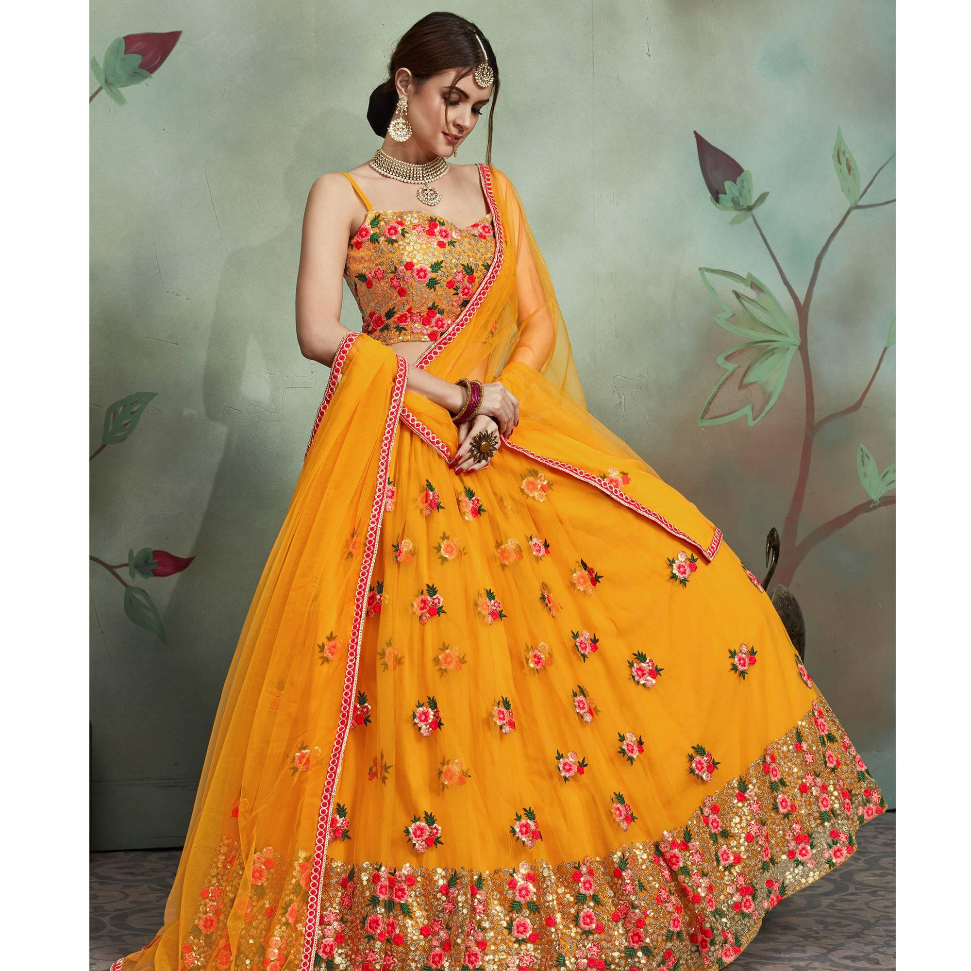 Demanding Mustard Yellow Colored Partywear Embroidered Netted Lehenga - Peachmode