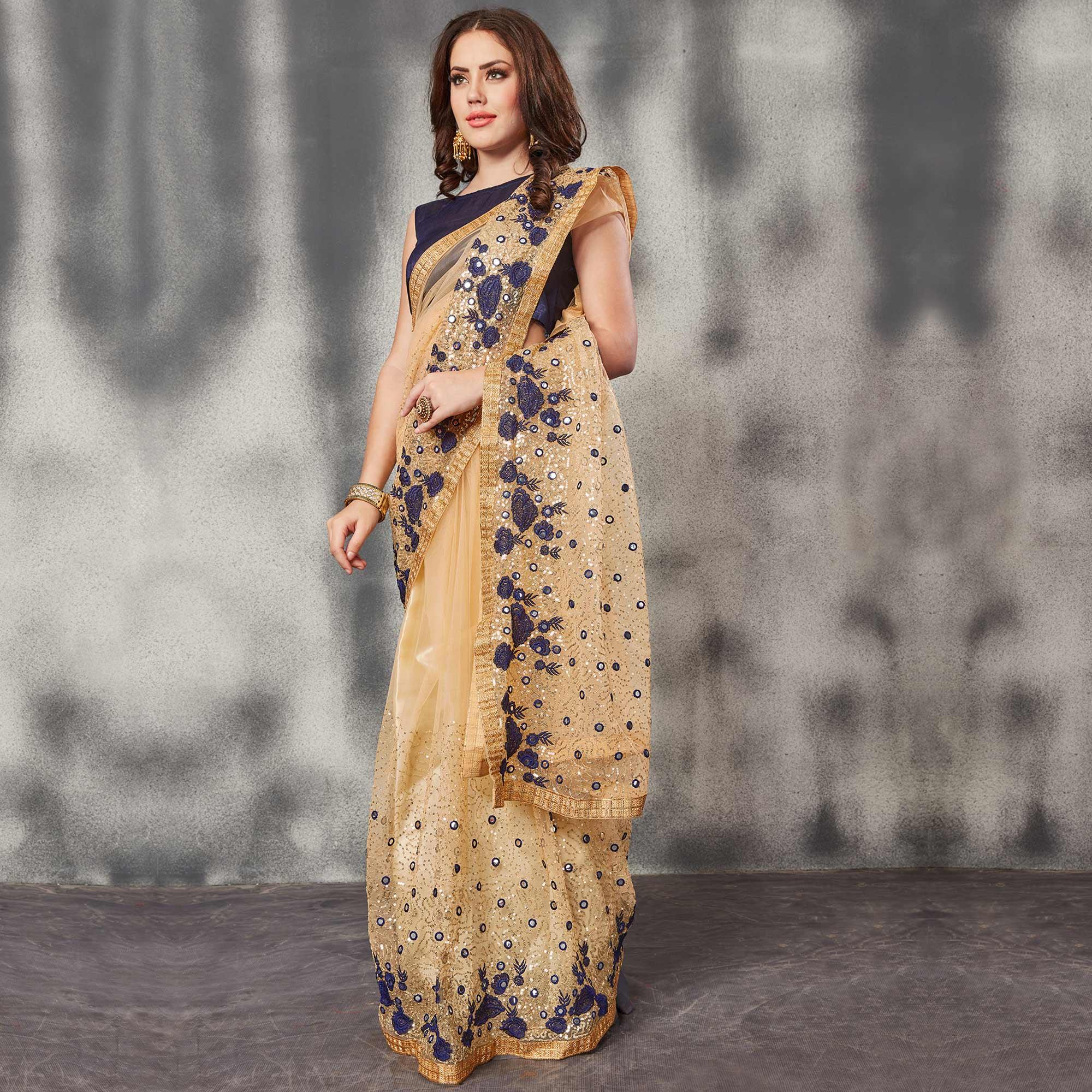 Desirable Beige Navy Blue Colored Partywear Embroidered Netted Saree - Peachmode