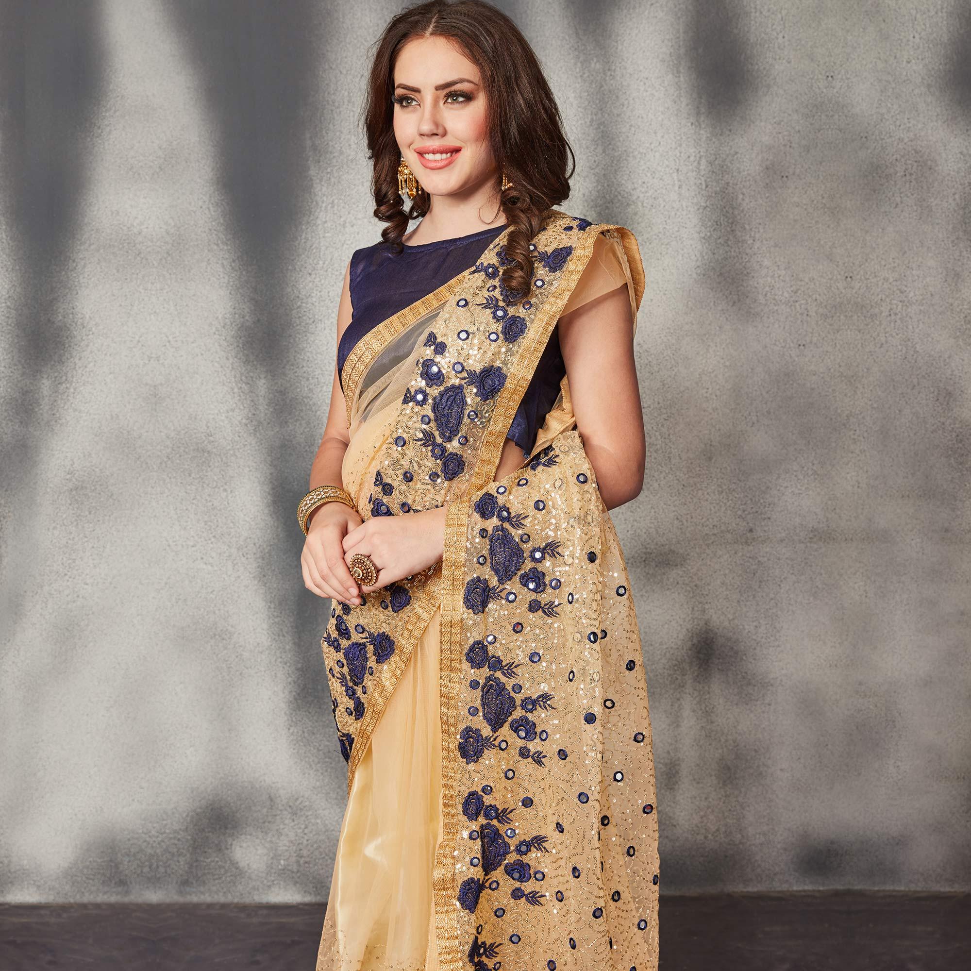 Desirable Beige Navy Blue Colored Partywear Embroidered Netted Saree - Peachmode