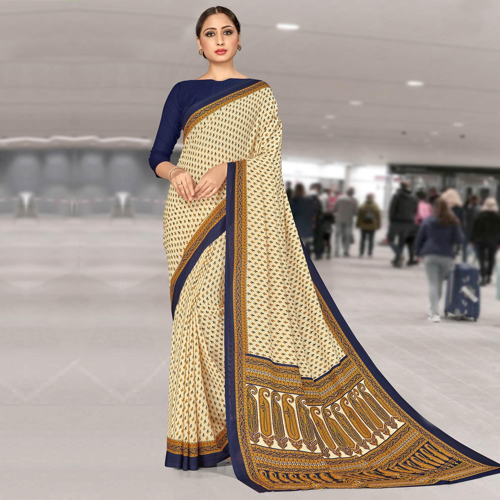 Desirable Cream Coloured Casual Wear Printed Crepe Saree - Peachmode