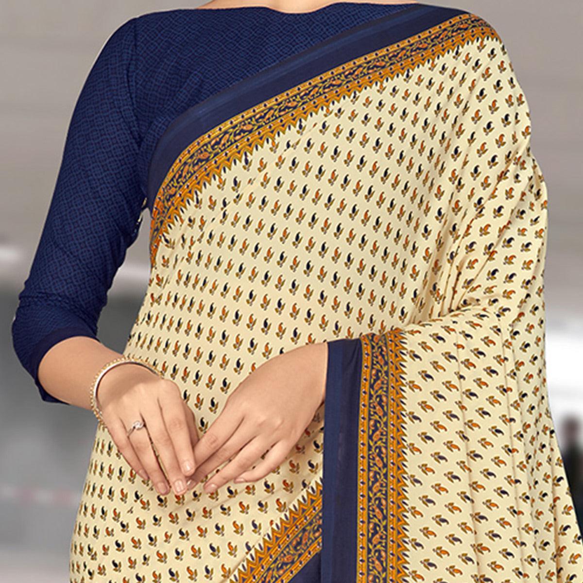 Desirable Cream Coloured Casual Wear Printed Crepe Saree - Peachmode