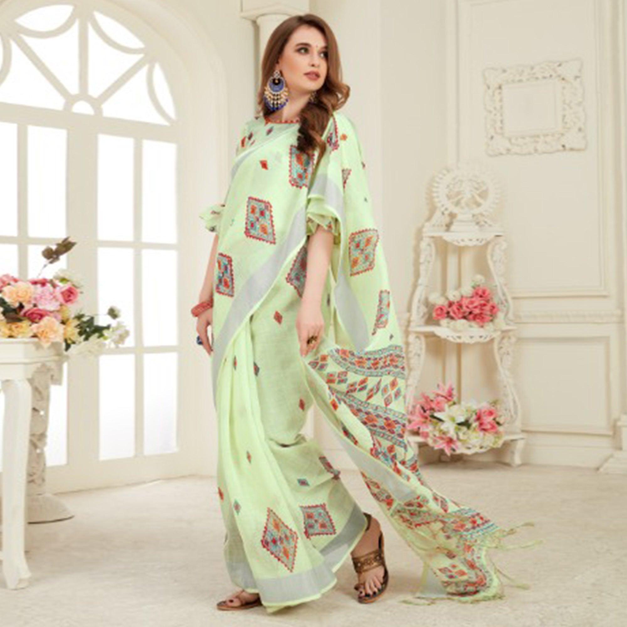 Desirable Light Green Colored Casual Printed Linen Saree With Tassels - Peachmode