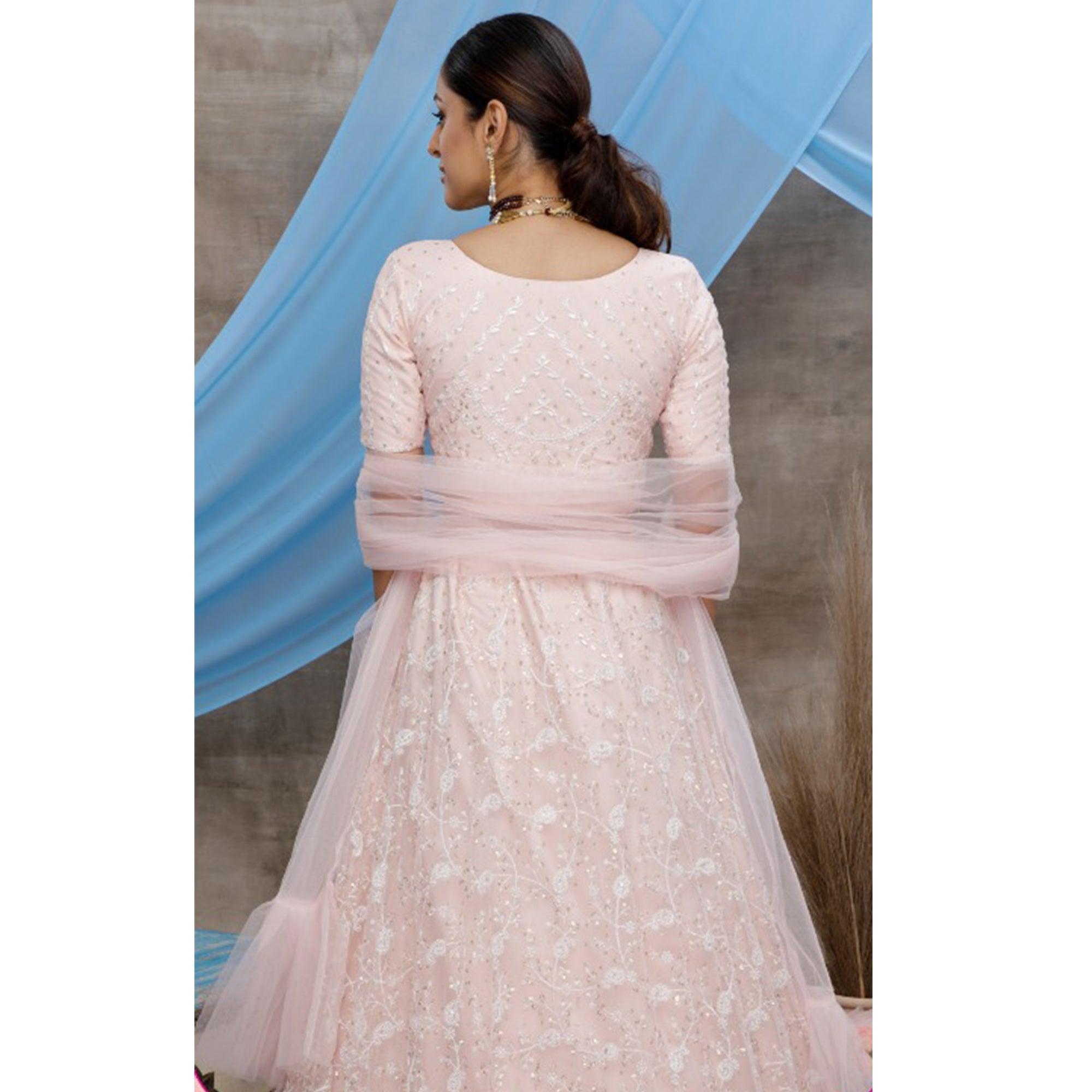Desirable Pastel Peach Colored Party Wear Embroidered Net Lehenga Choli - Peachmode