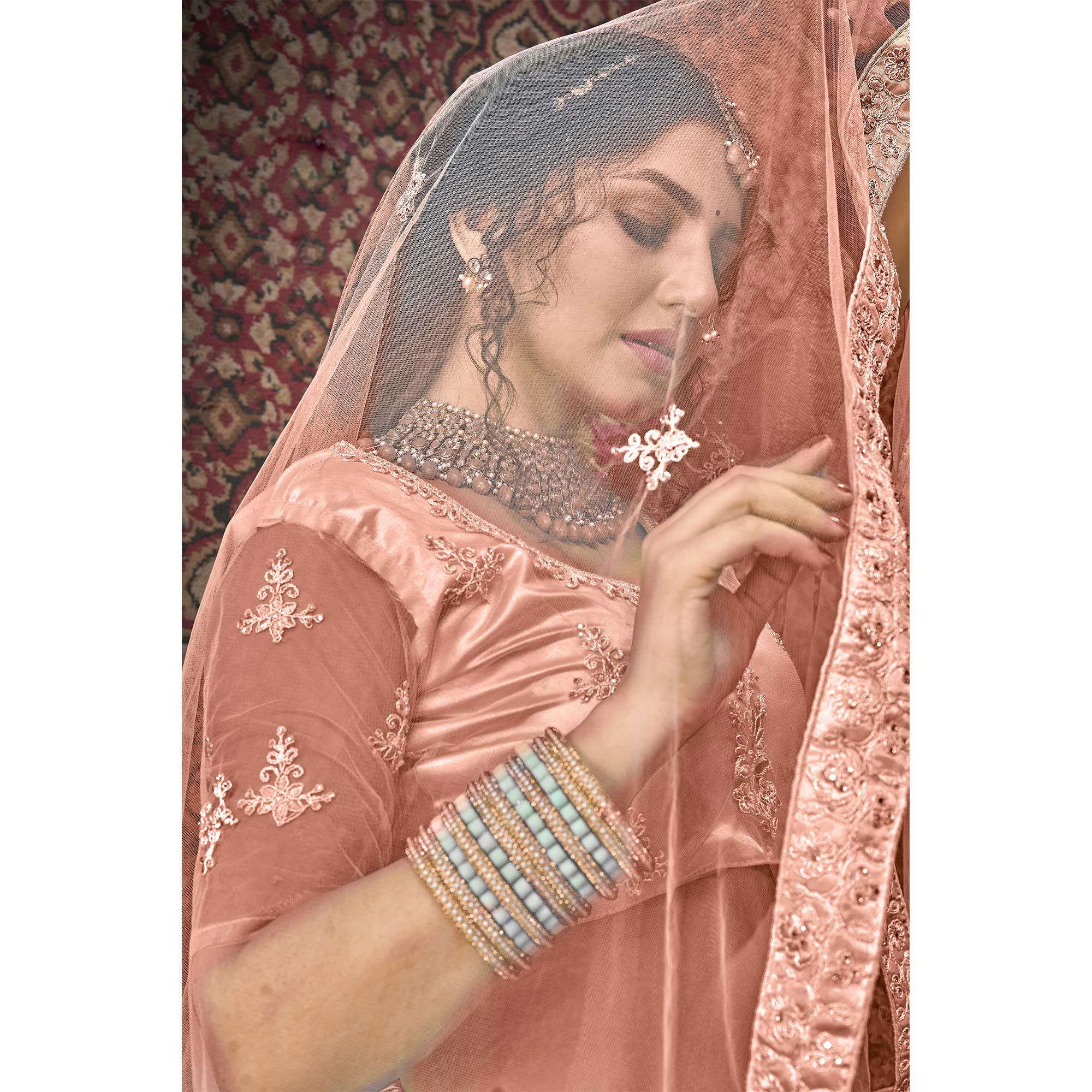 Dusty Pink Partywear Multi Sequence Embroidered Net Lehenga Choli - Peachmode