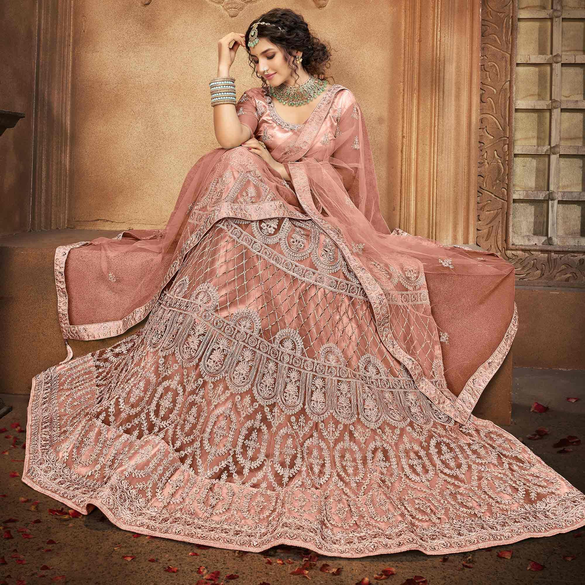 Dusty Pink Partywear Multi Sequence Embroidered Net Lehenga Choli - Peachmode