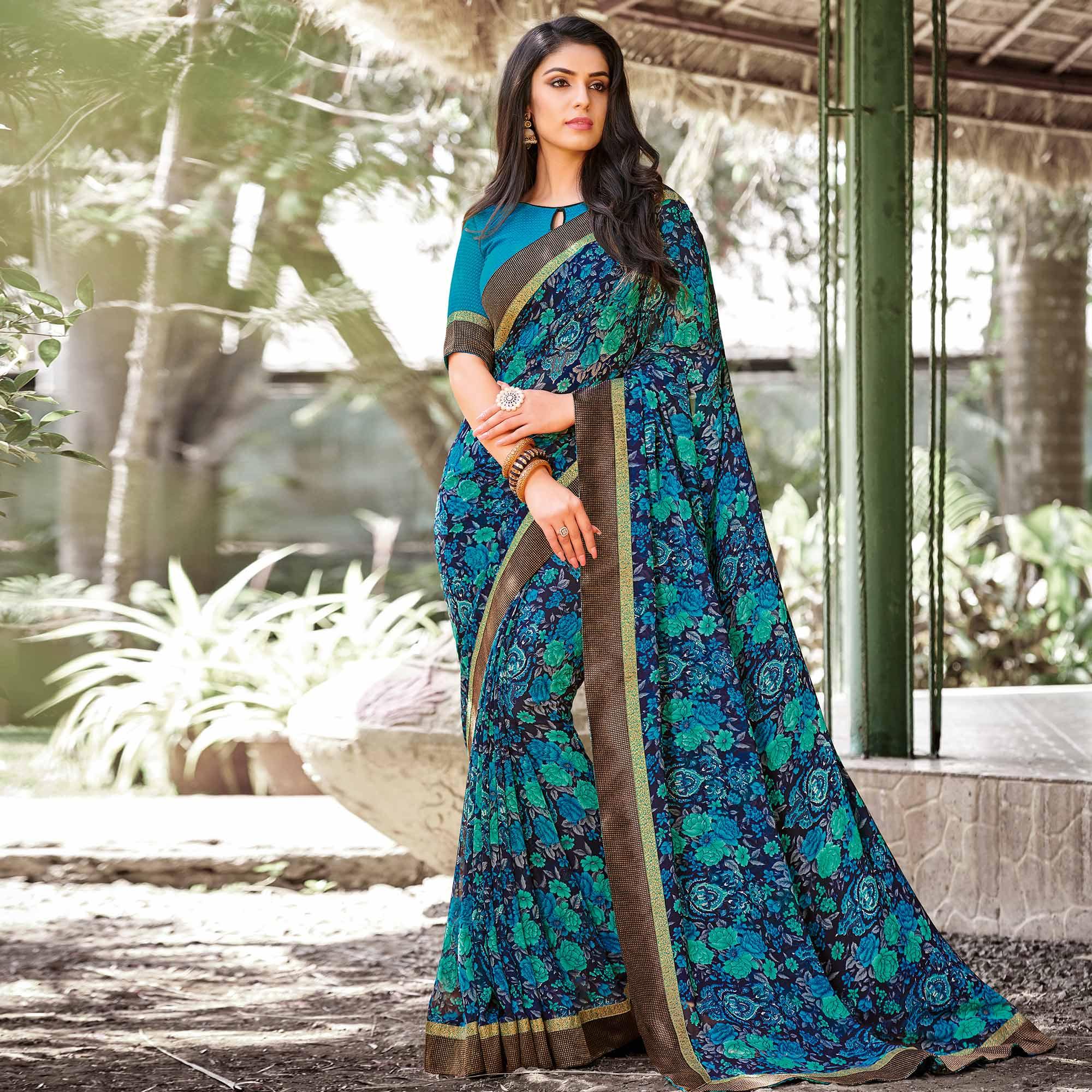 Elegant Peacock Blue Colored Partywear Printed Georgette Saree - Peachmode