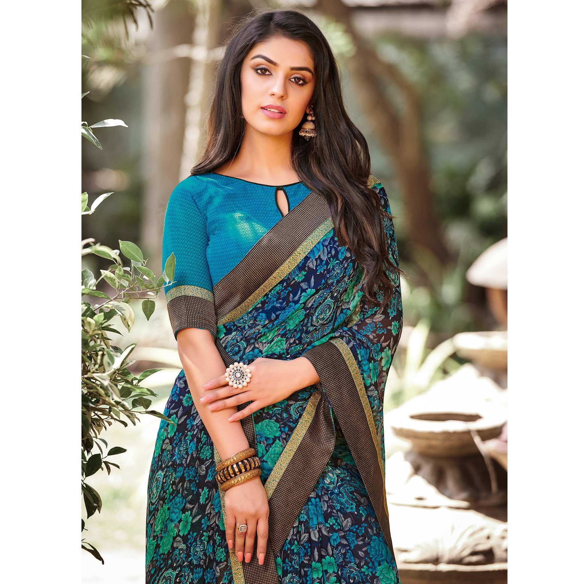 Elegant Peacock Blue Colored Partywear Printed Georgette Saree - Peachmode