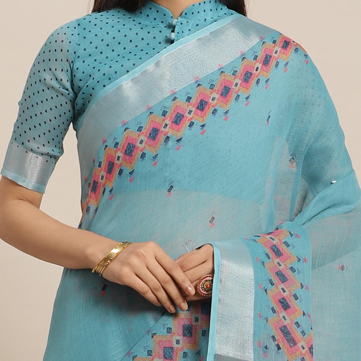 Energetic Teal Blue Colored Casual Wear Printed Linen Saree - Peachmode