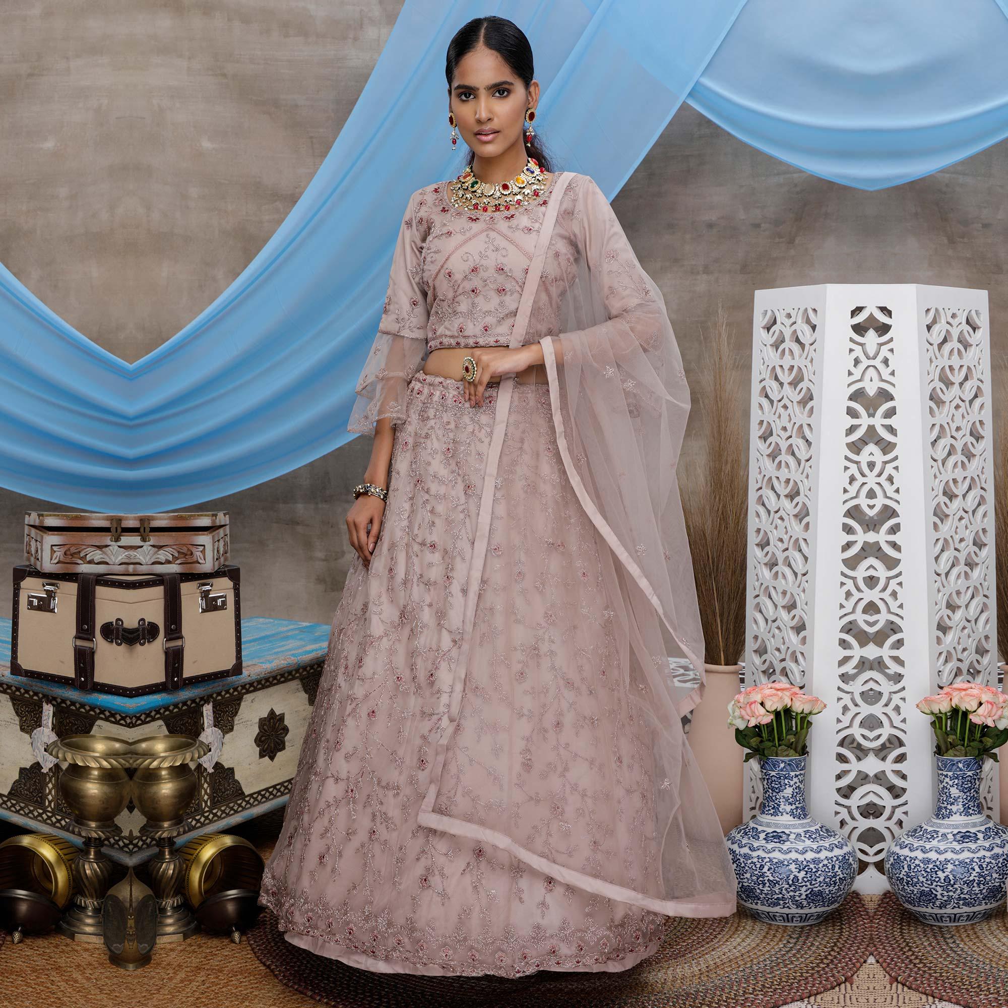 Engrossing Dusty Purple Colored Party Wear Heavy Embroidered Net Lehenga Choli - Peachmode