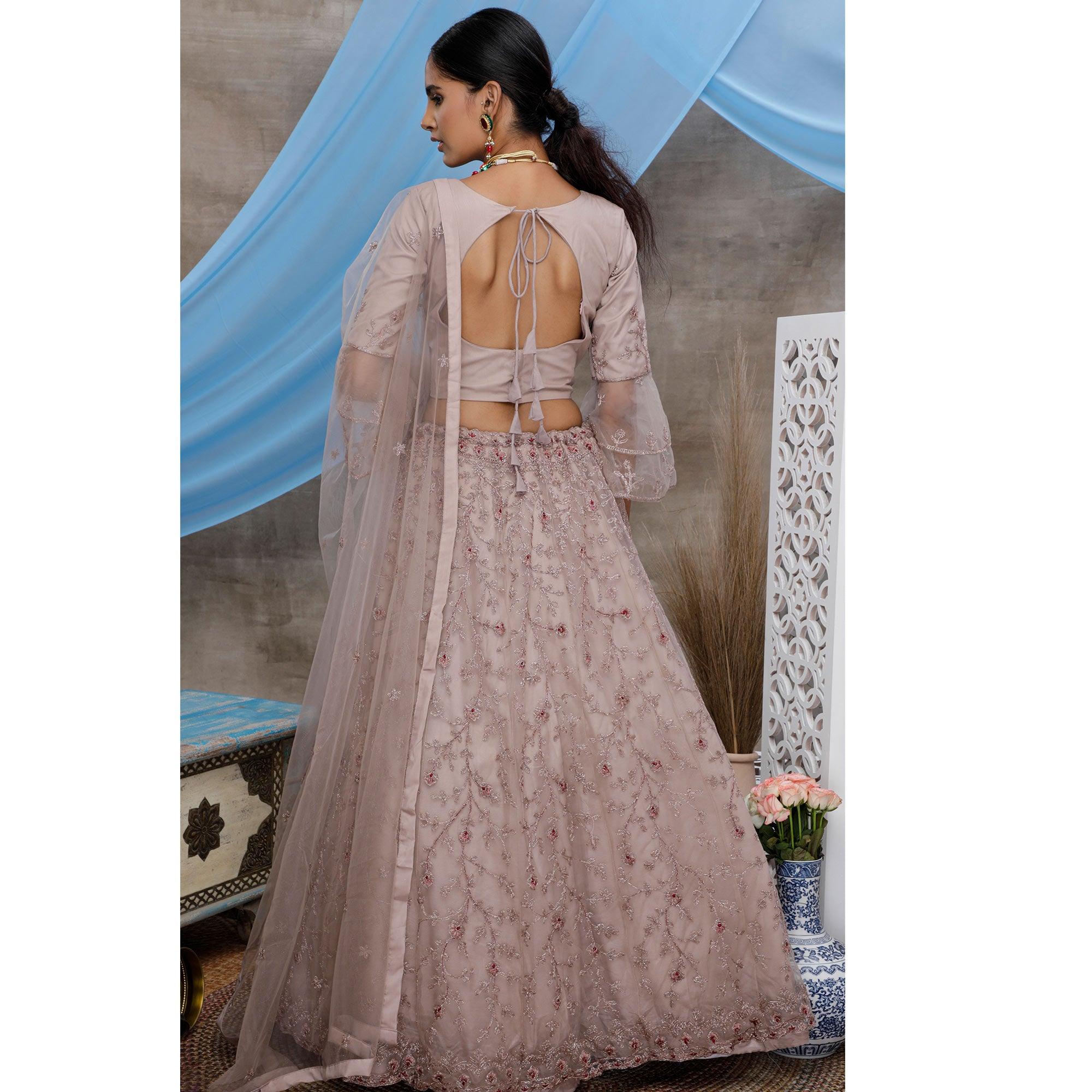Engrossing Dusty Purple Colored Party Wear Heavy Embroidered Net Lehenga Choli - Peachmode