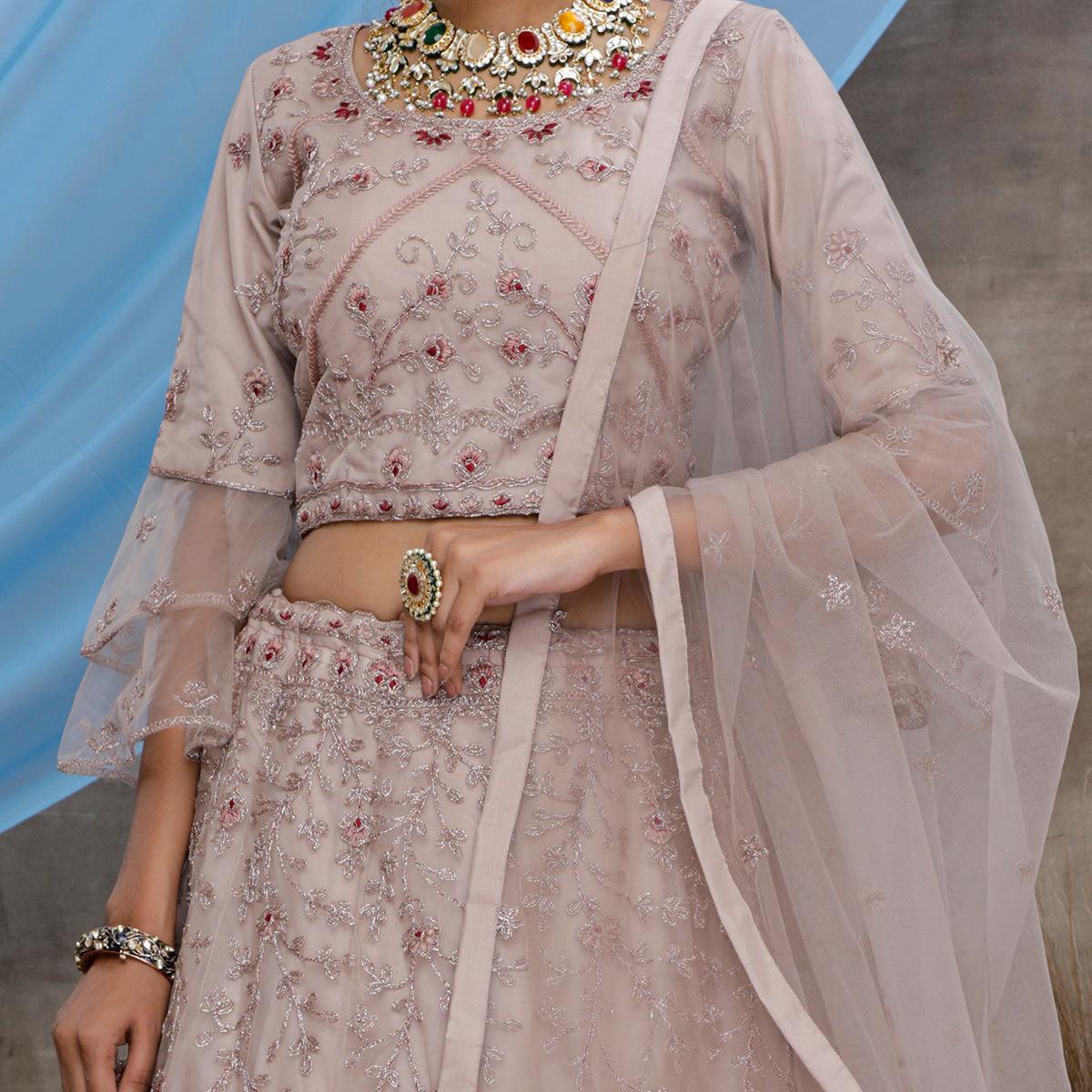 Engrossing Dusty Purple Colored Party Wear Heavy Embroidered Net Lehenga Choli - Peachmode