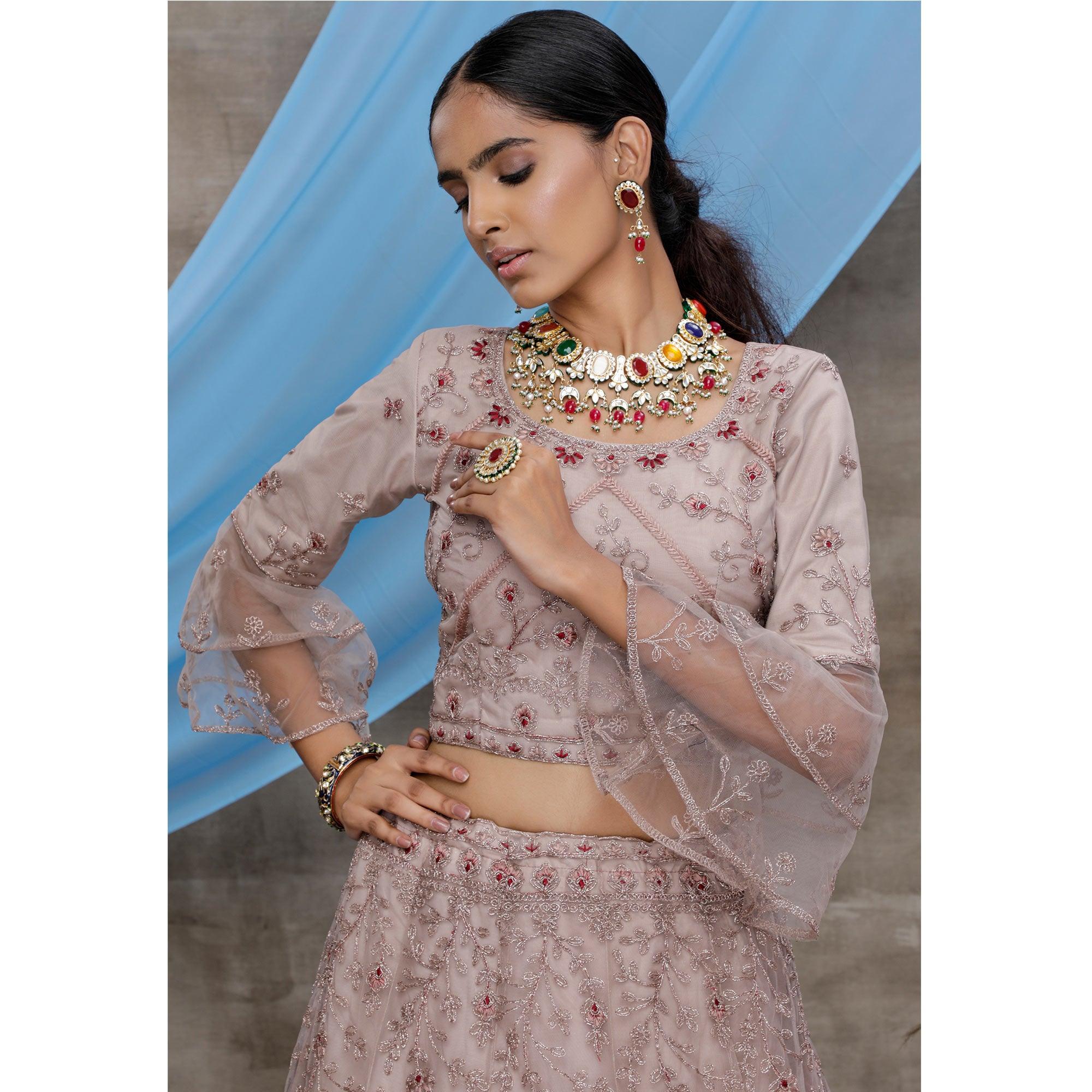 Engrossing Dusty Purple Colored Party Wear Heavy Embroidered Net Lehenga Choli - Peachmode