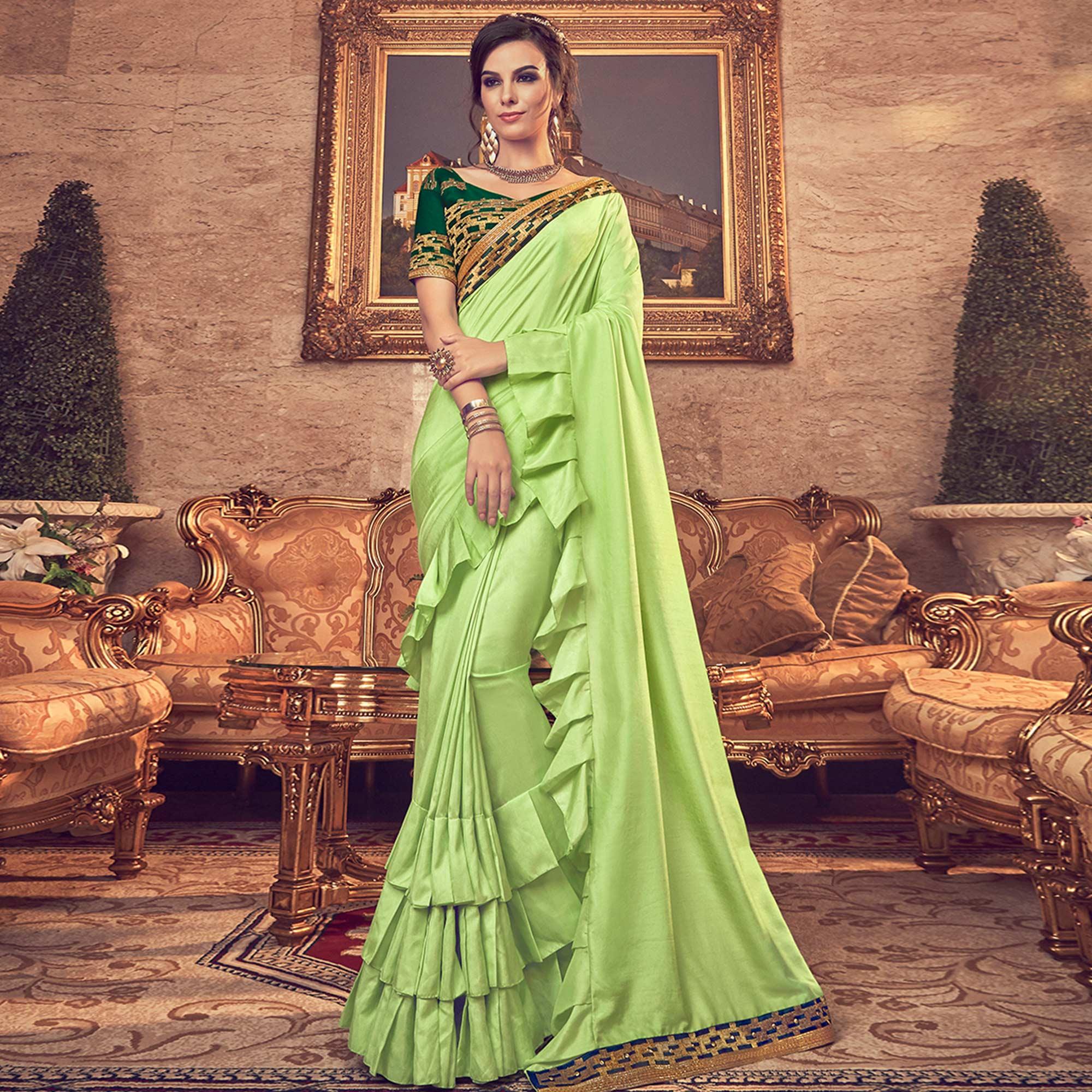 Entrancing Green Colored Partywear Embroidered Georgette Saree - Peachmode