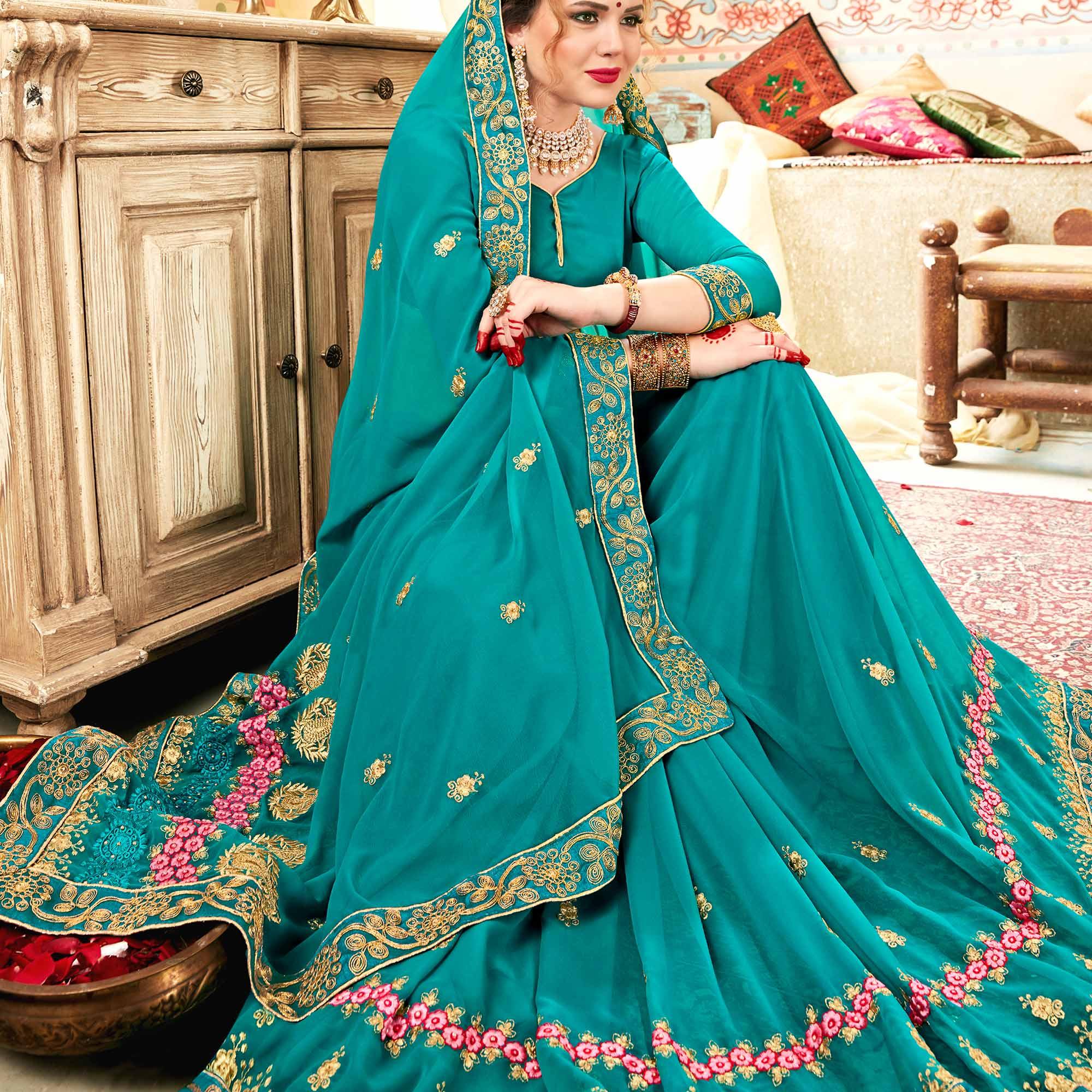 Exceptional Aqua Blue Colored Partywear Embroidered Georgette Saree - Peachmode
