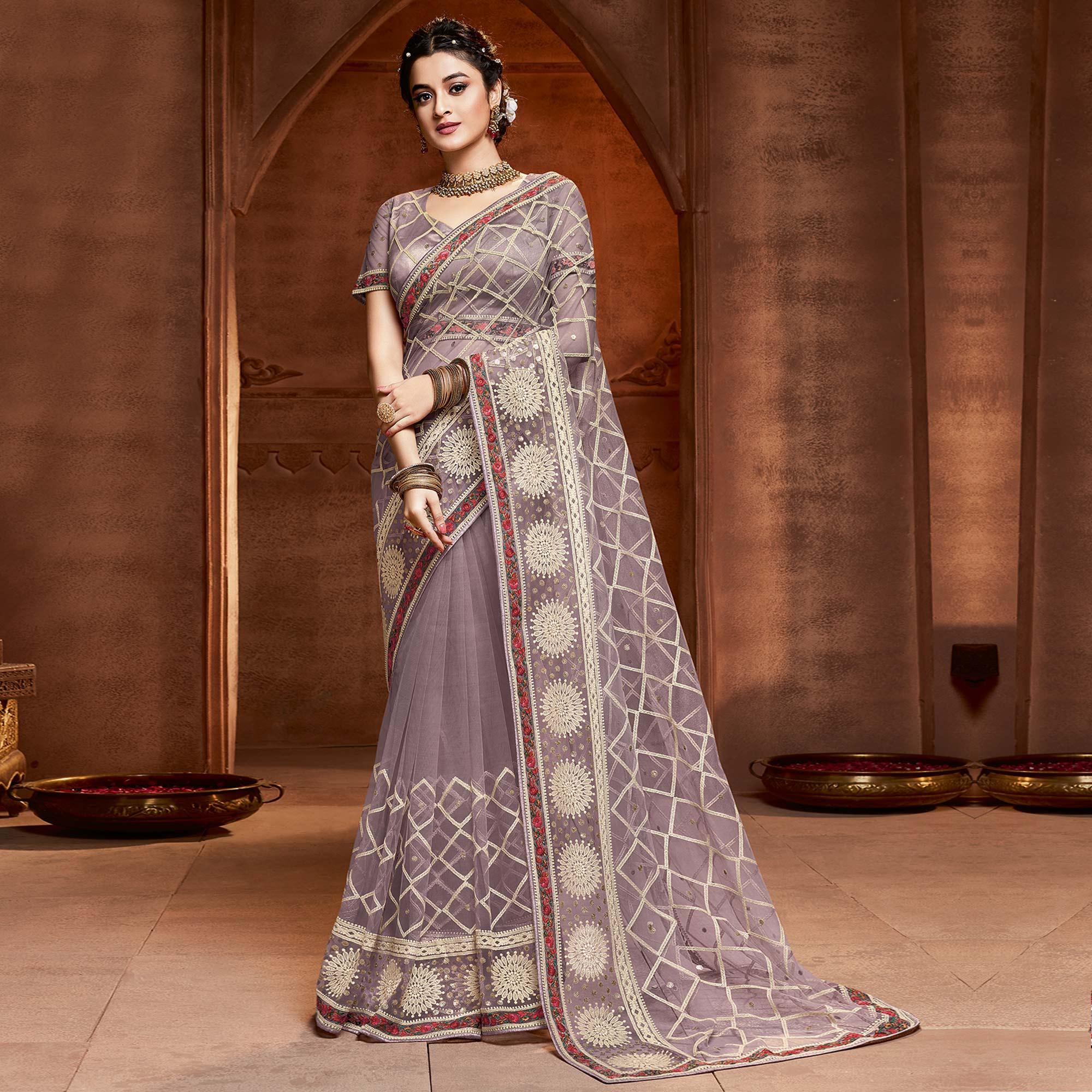 Exclusive Mauve Coloured Partywear Embroidered Soft Net Saree - Peachmode
