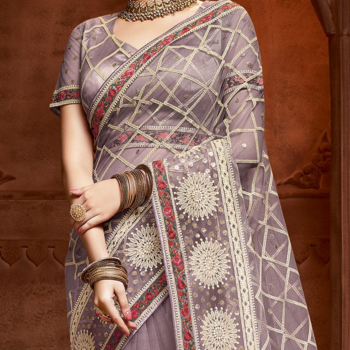 Exclusive Mauve Coloured Partywear Embroidered Soft Net Saree - Peachmode