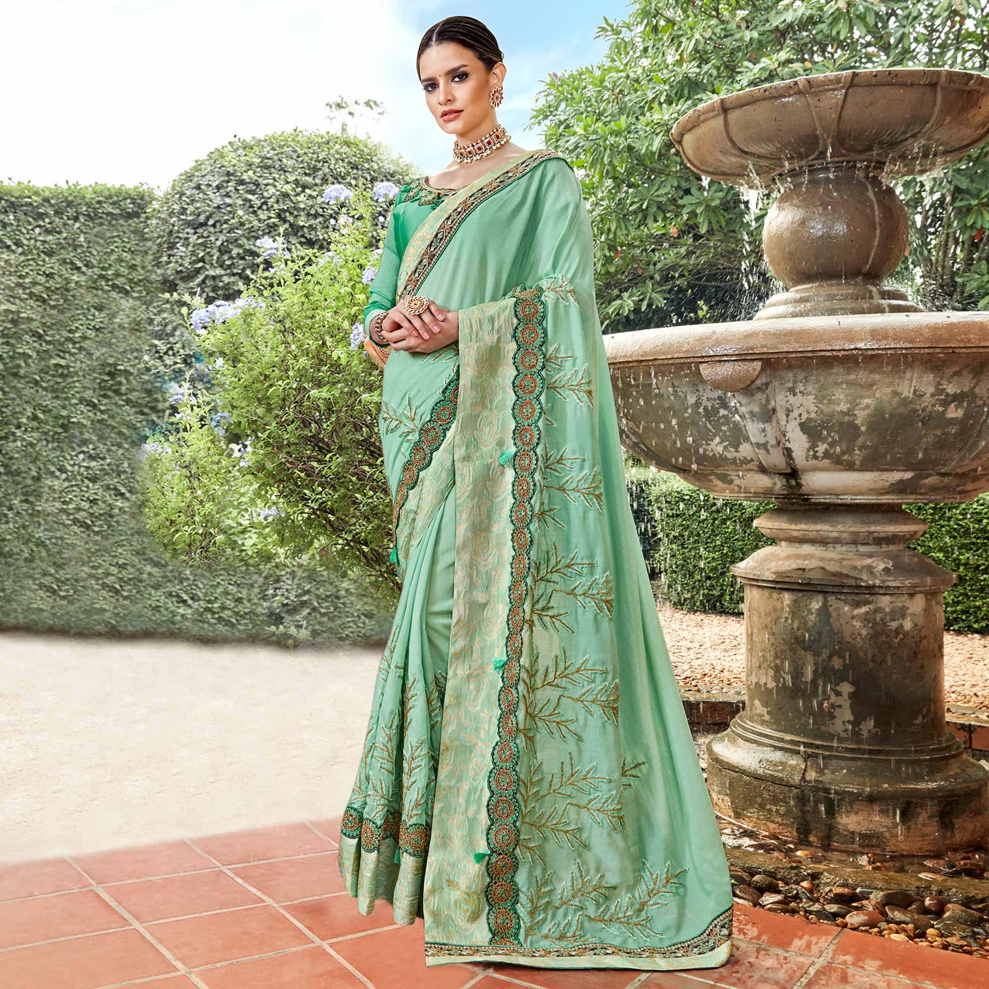 Exotic Aqua Green Colored Partywear Embroidered Georgette Saree - Peachmode