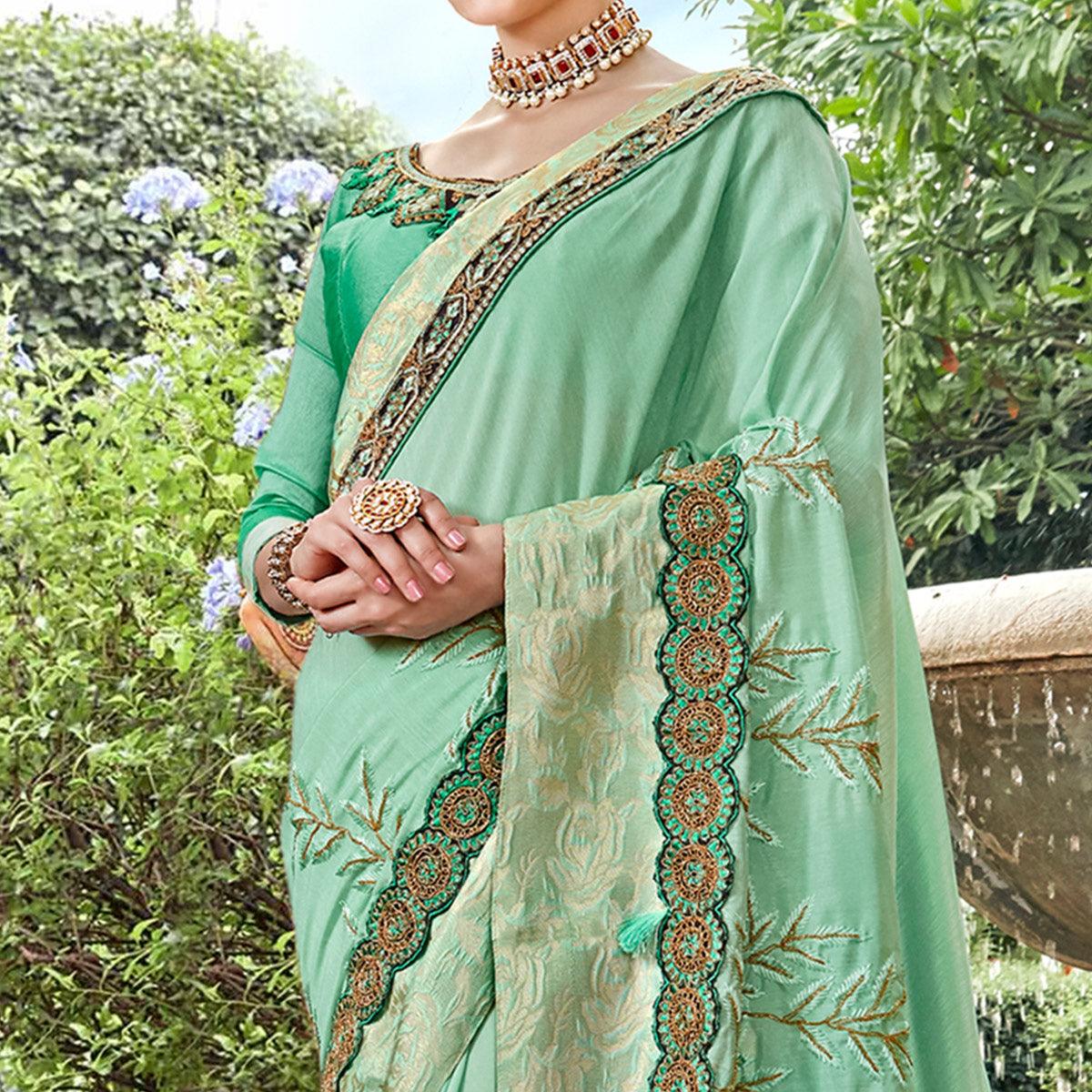 Exotic Aqua Green Colored Partywear Embroidered Georgette Saree - Peachmode