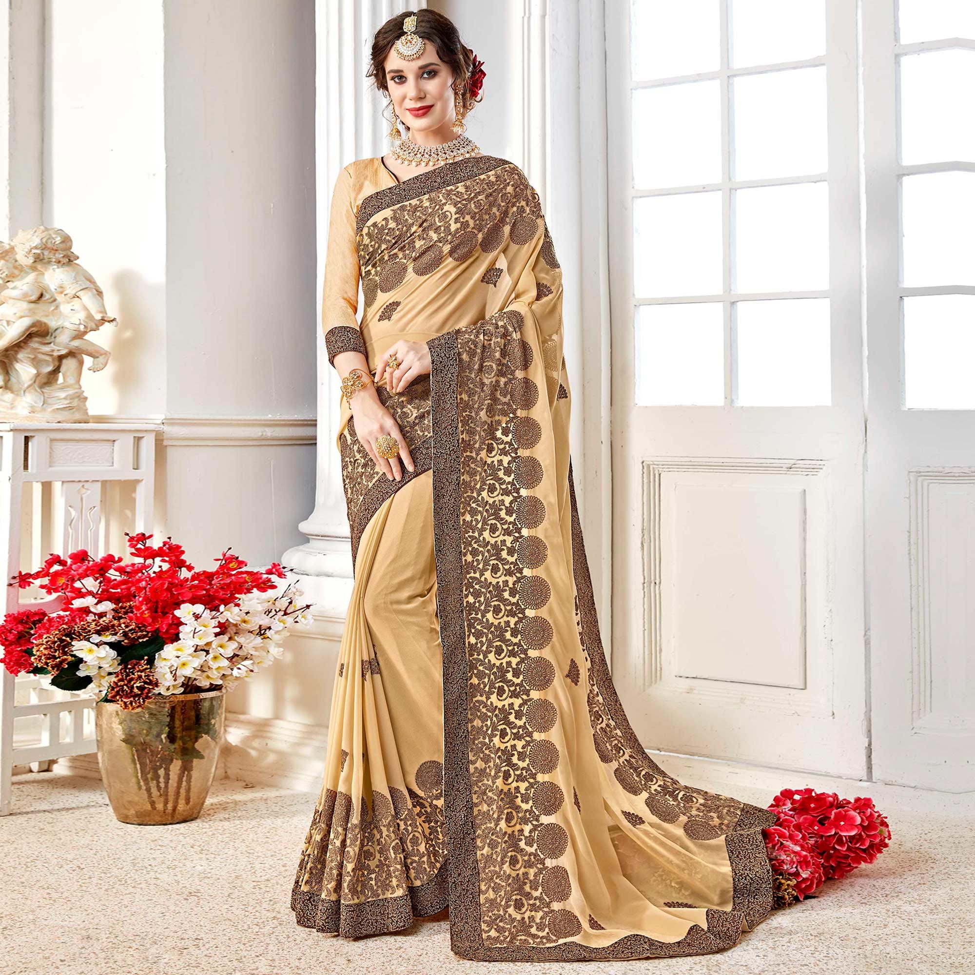 Exotic Beige Colored Partywear Embroidered Georgette Saree - Peachmode