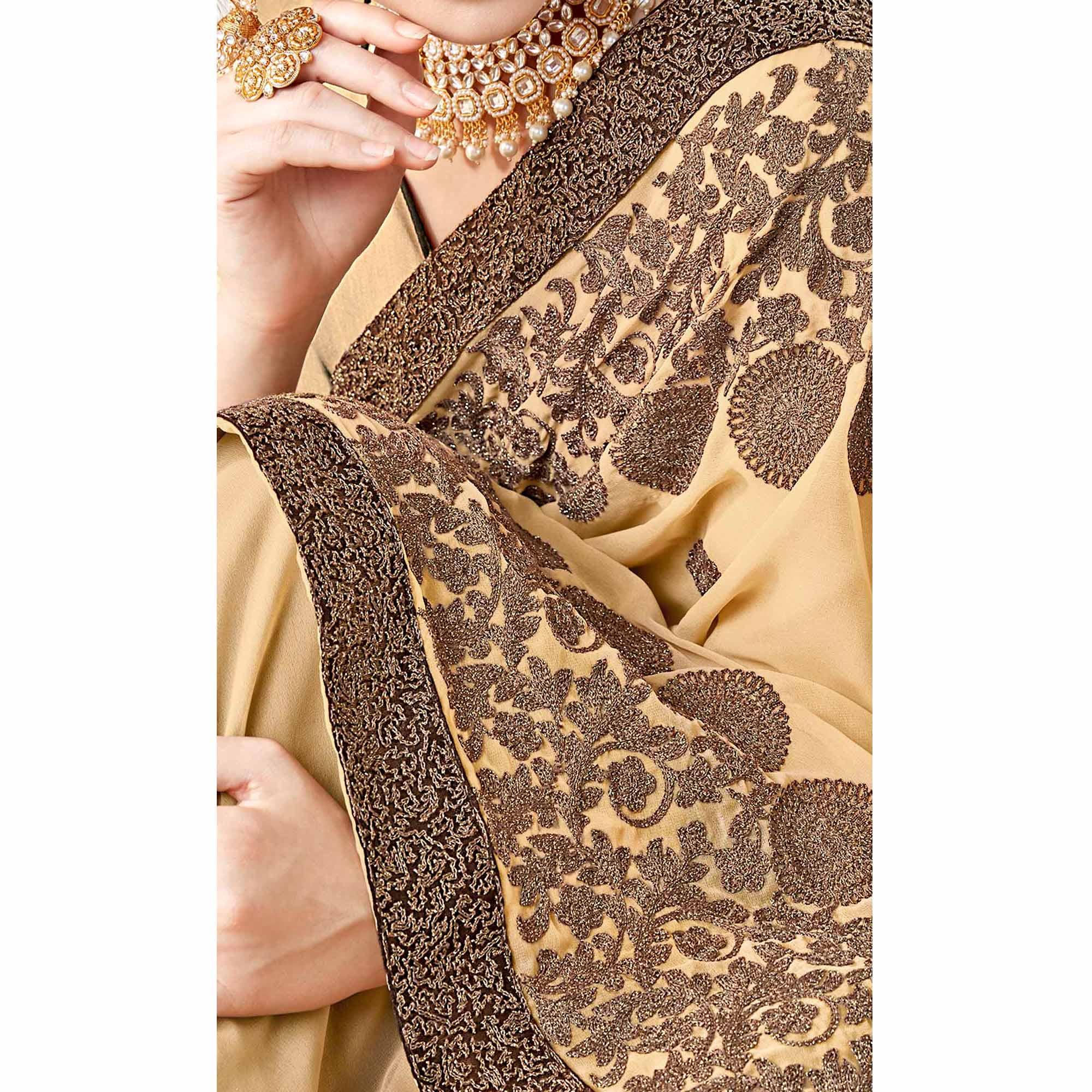 Exotic Beige Colored Partywear Embroidered Georgette Saree - Peachmode