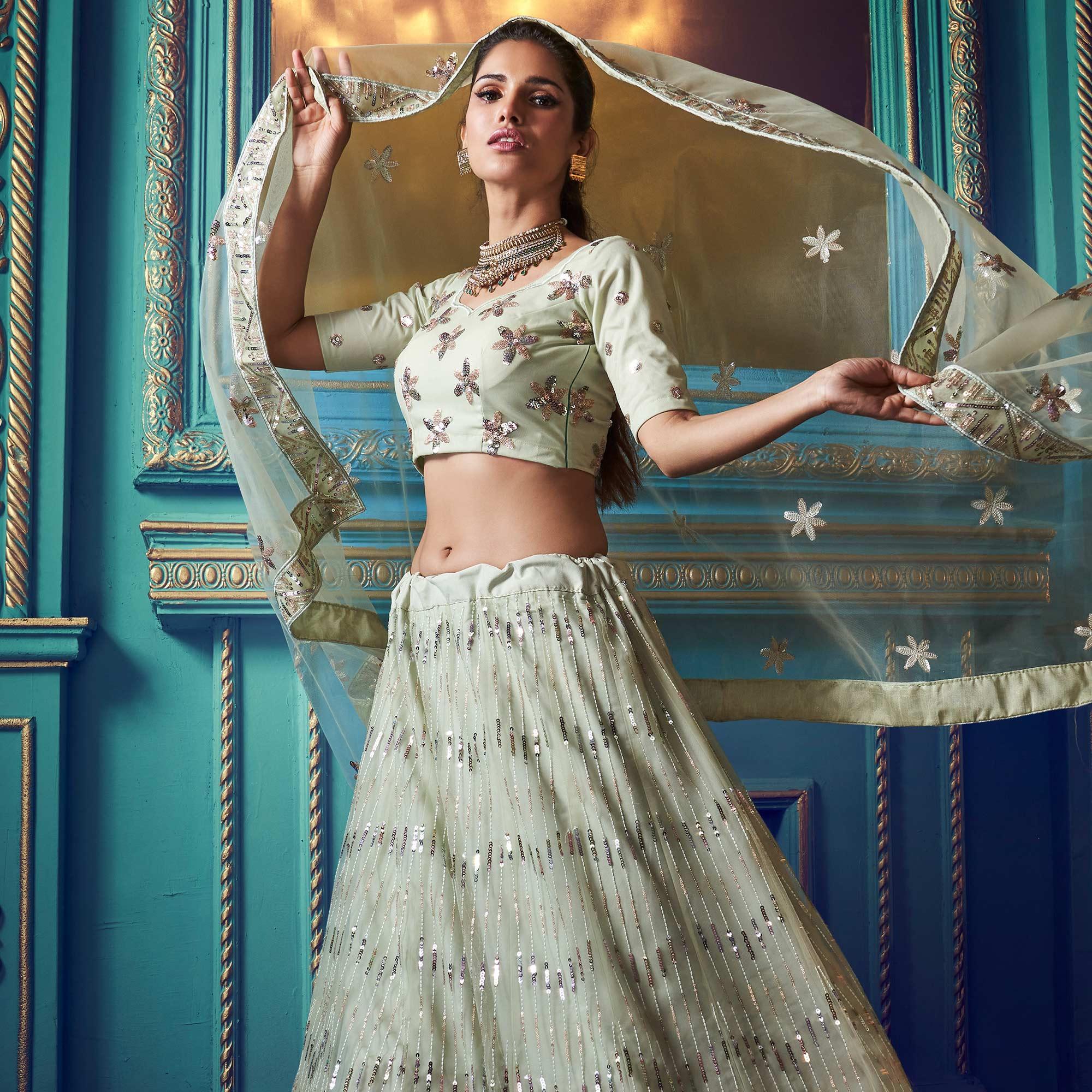 Exotic Pastel Green Colored Partywear Embroidered Soft Net Lehenga Choli - Peachmode