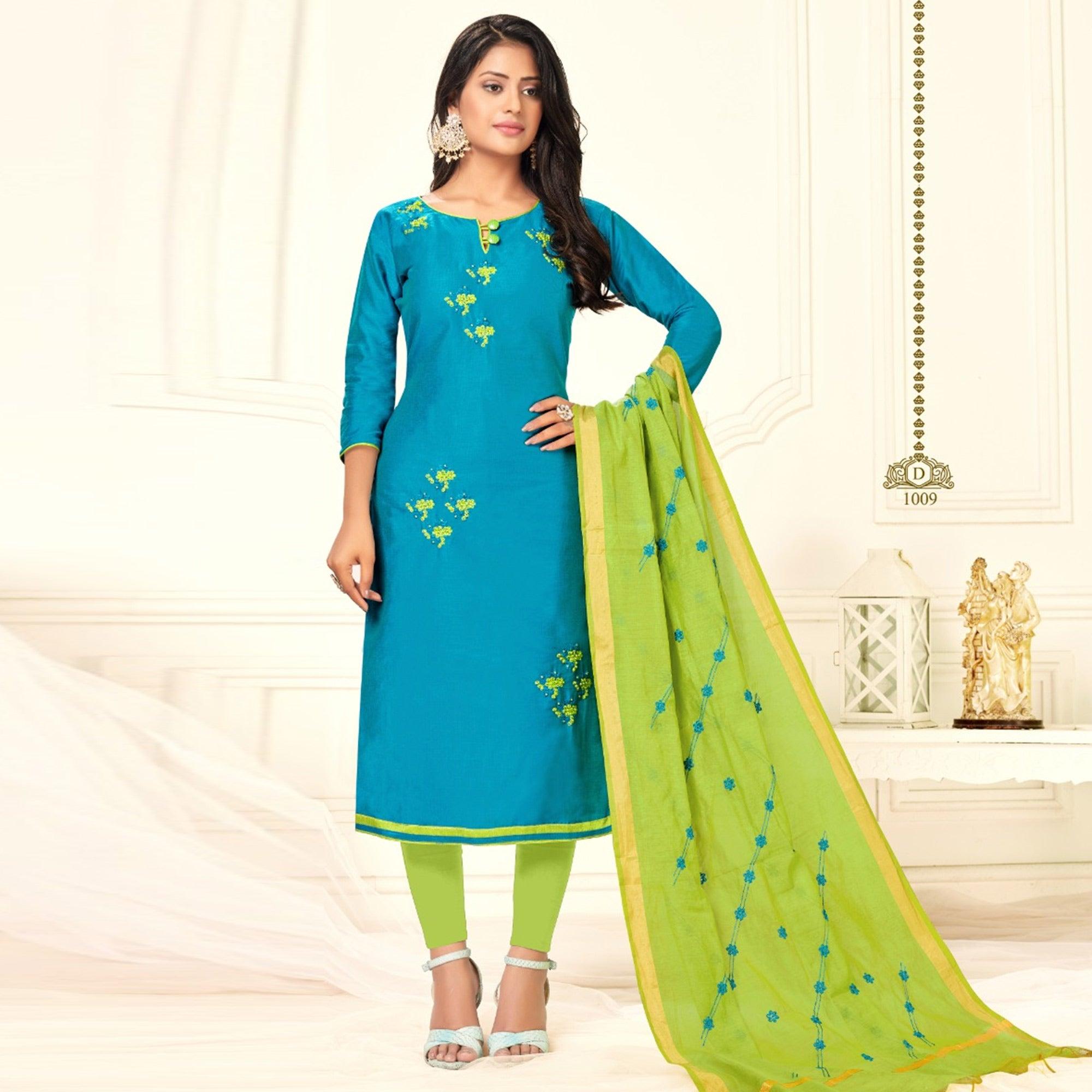Eye-catching Firozi Colored Casual Wear Embroidered Cotton Dress Material - Peachmode