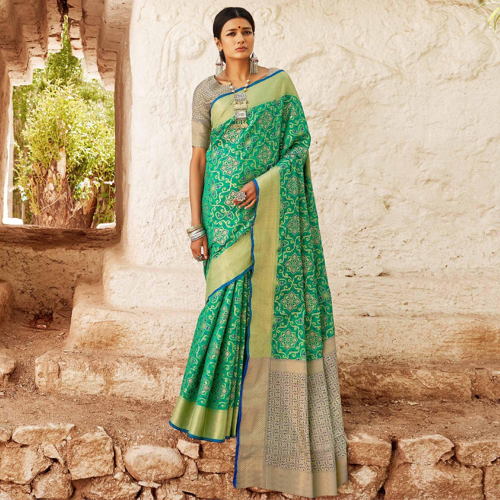 Eye-catching Turquoise Green Colored Festive Wear Woven Silk Saree - Peachmode