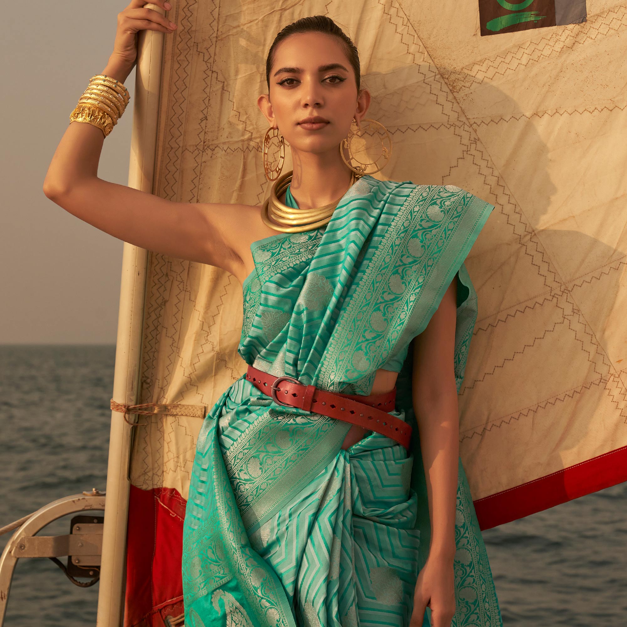 Sea Green Woven Satin Saree With Tassels