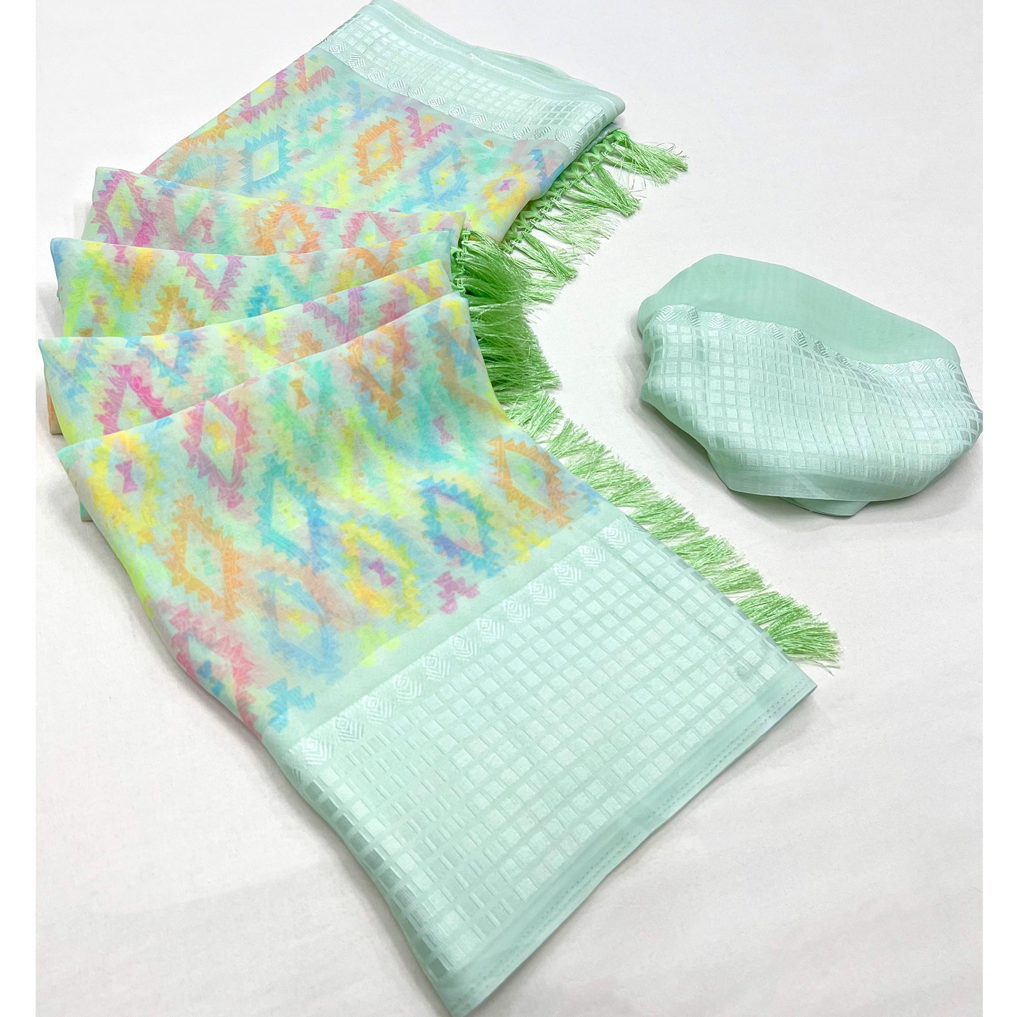 Sea Green Printed Georgette Saree With Tassels