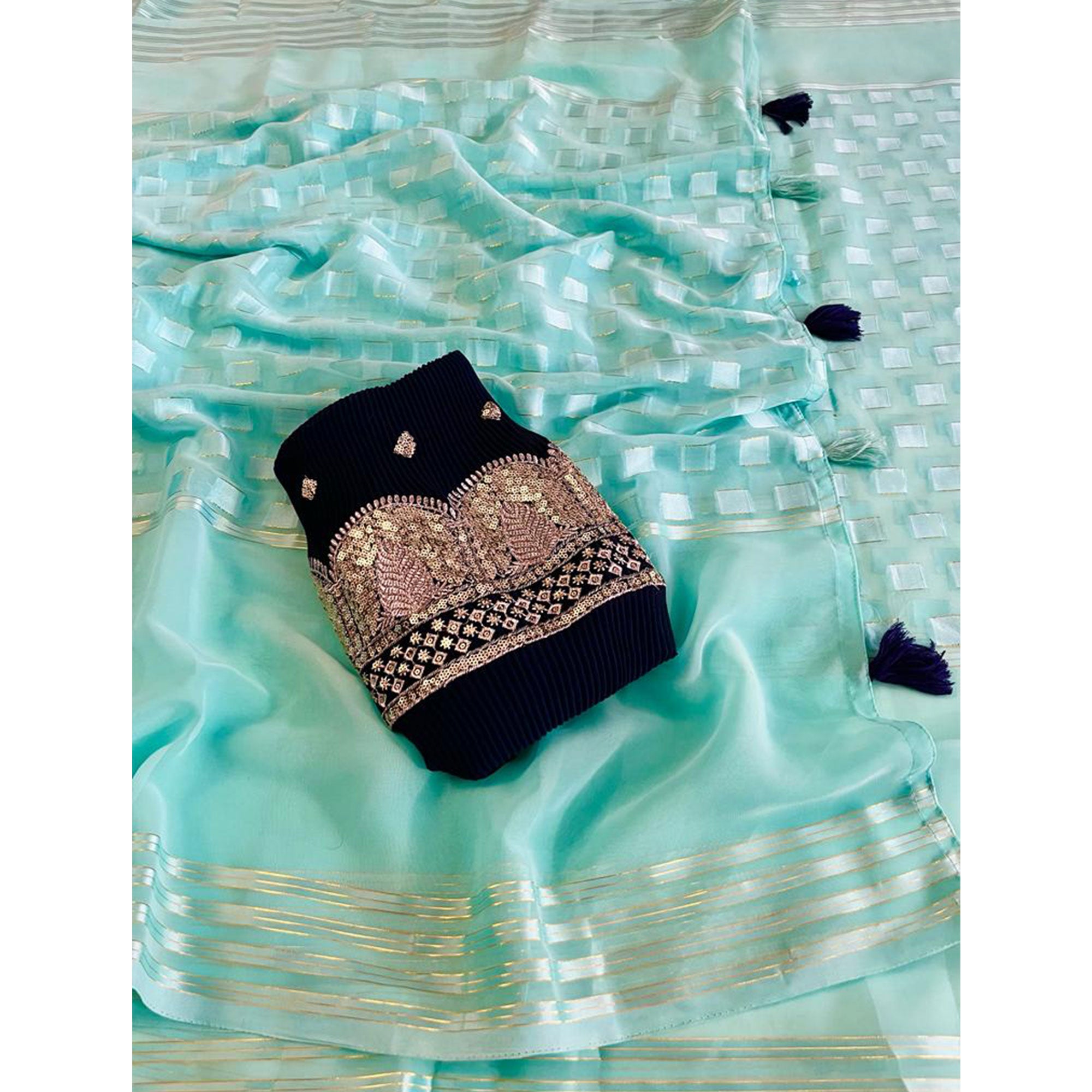 Turquoise Woven Georgette Saree With Tassels