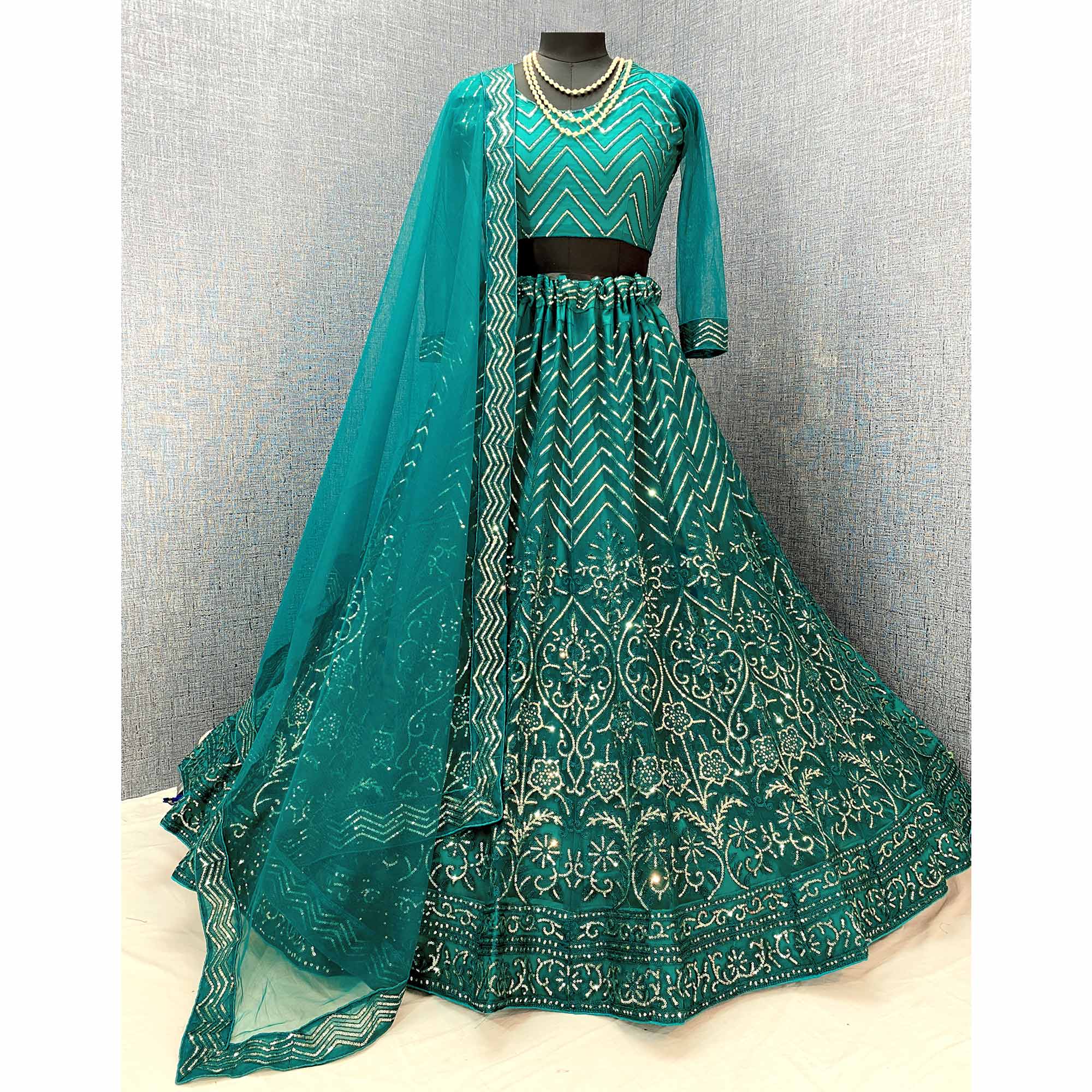 Rama Green Sequins Embroidered Netted Lehenga Choli