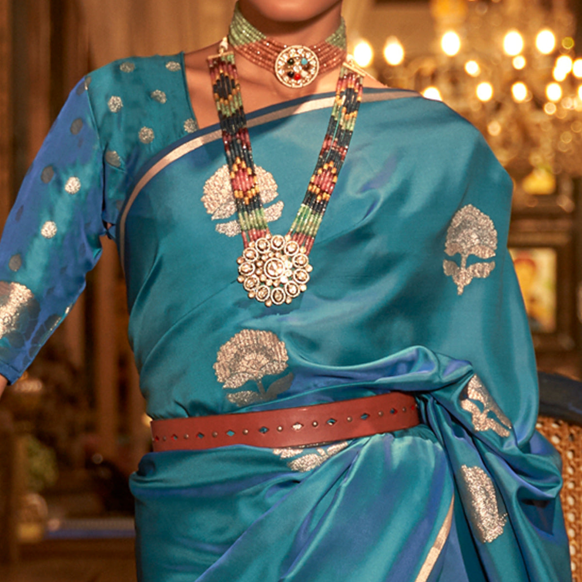 Teal Blue Floral Woven Satin Saree With Tassels