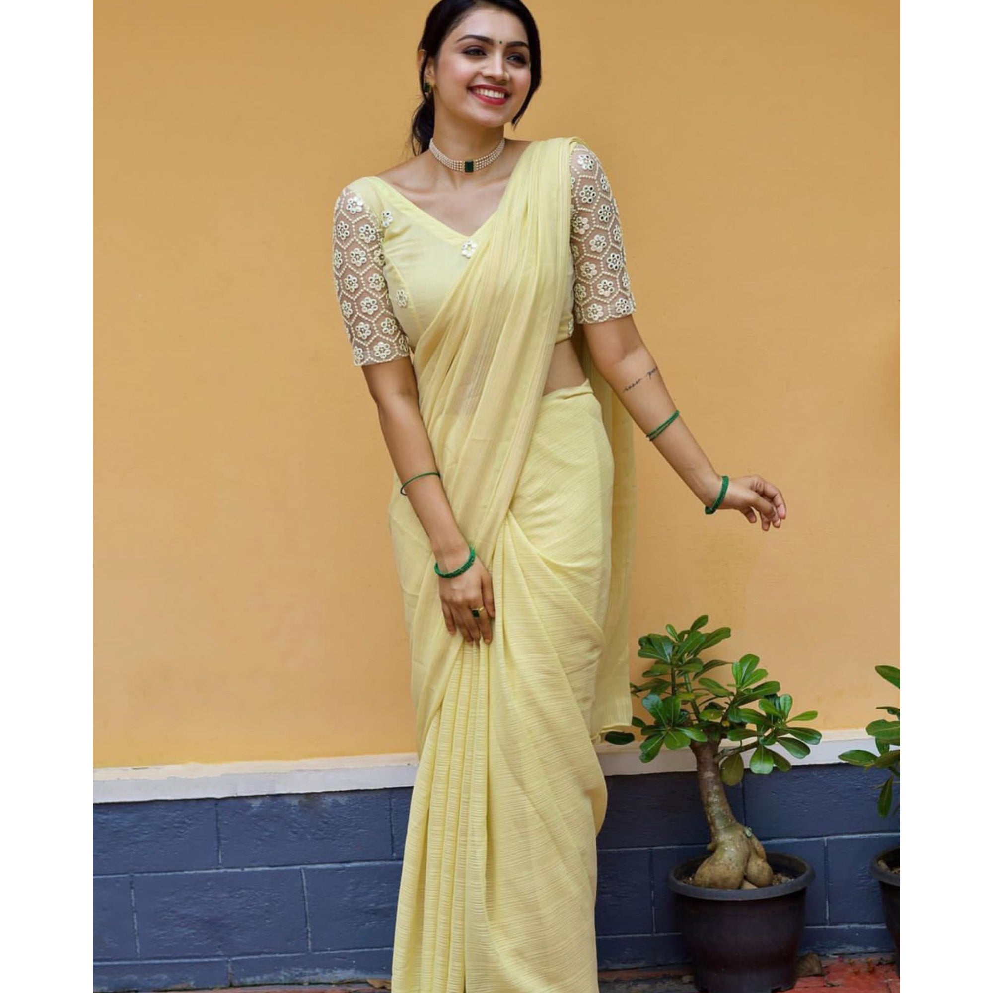 Light Yellow Solid Chiffon Saree With Tassels