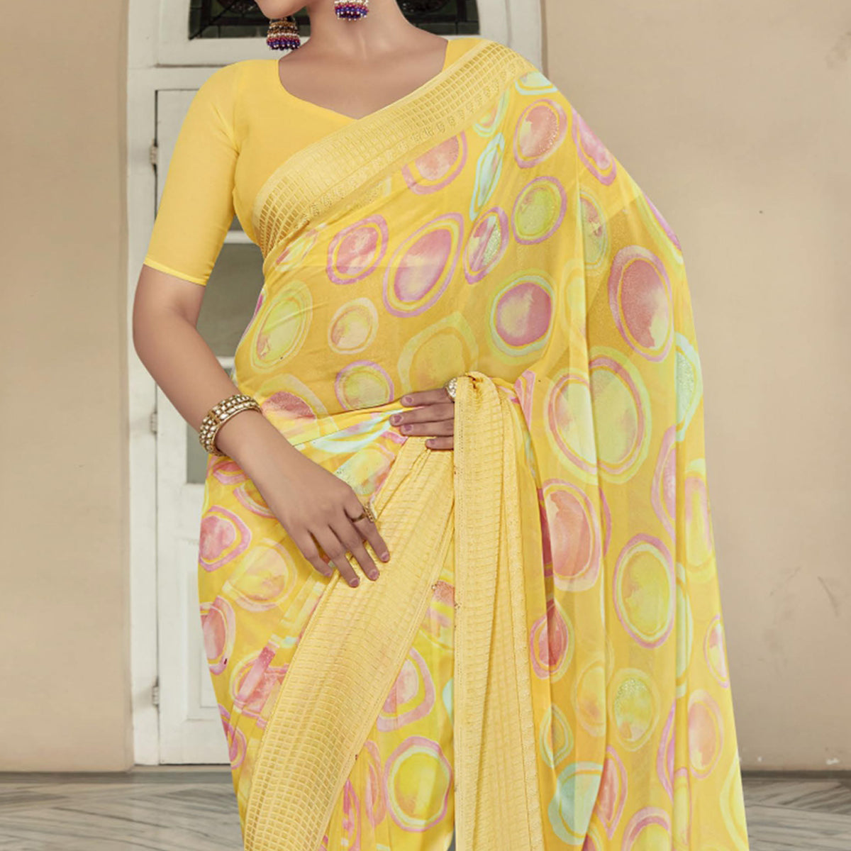 Yellow Printed Georgette Saree With Checks Border