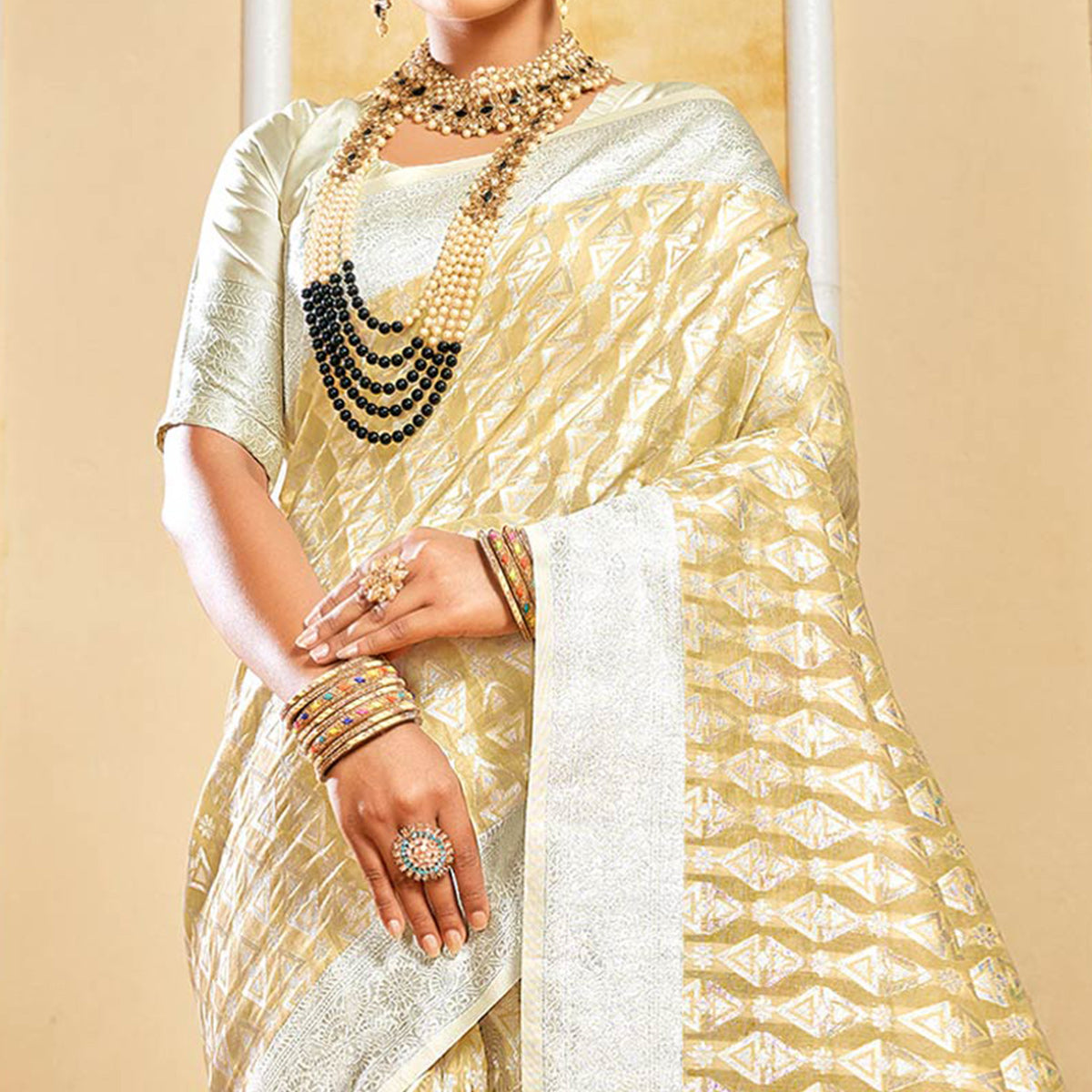 Beige Woven Cotton Silk Saree With Tassels