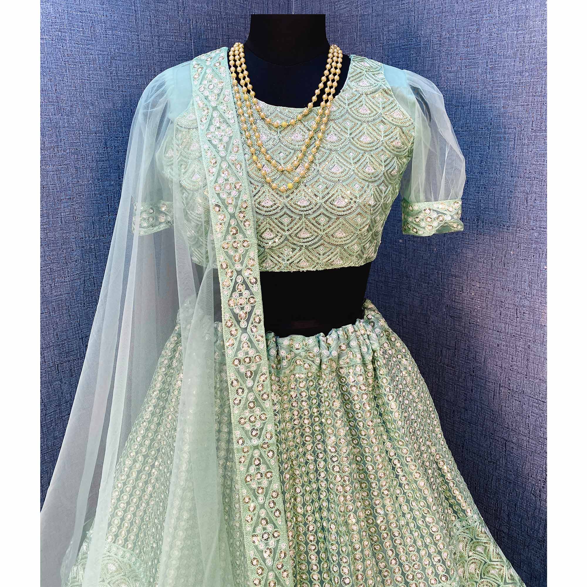 Sea Green Sequins Embroidered Netted Lehenga Choli