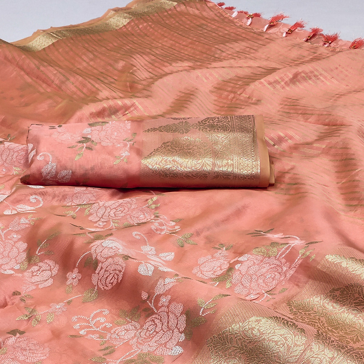 Peach Woven Organza Saree With Tassels