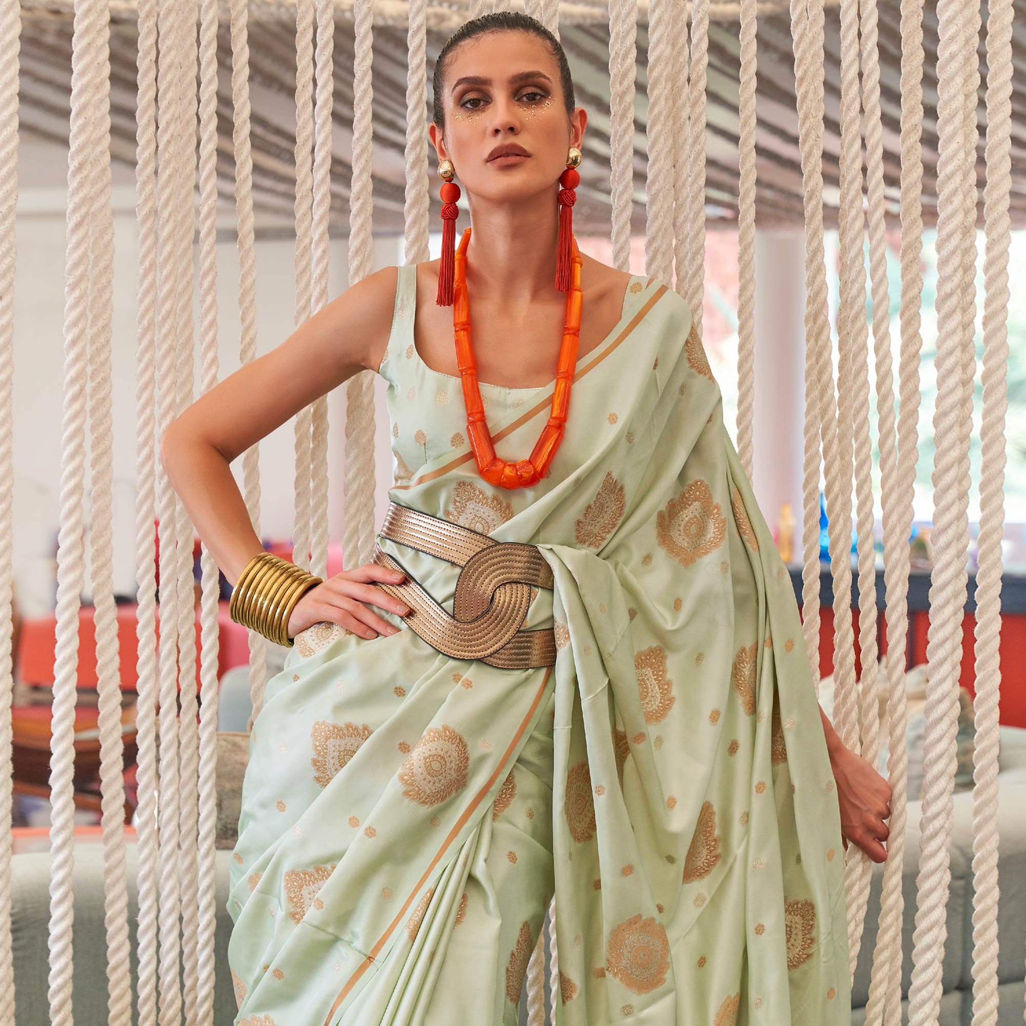 Pista Green Woven Satin Saree With Tassels