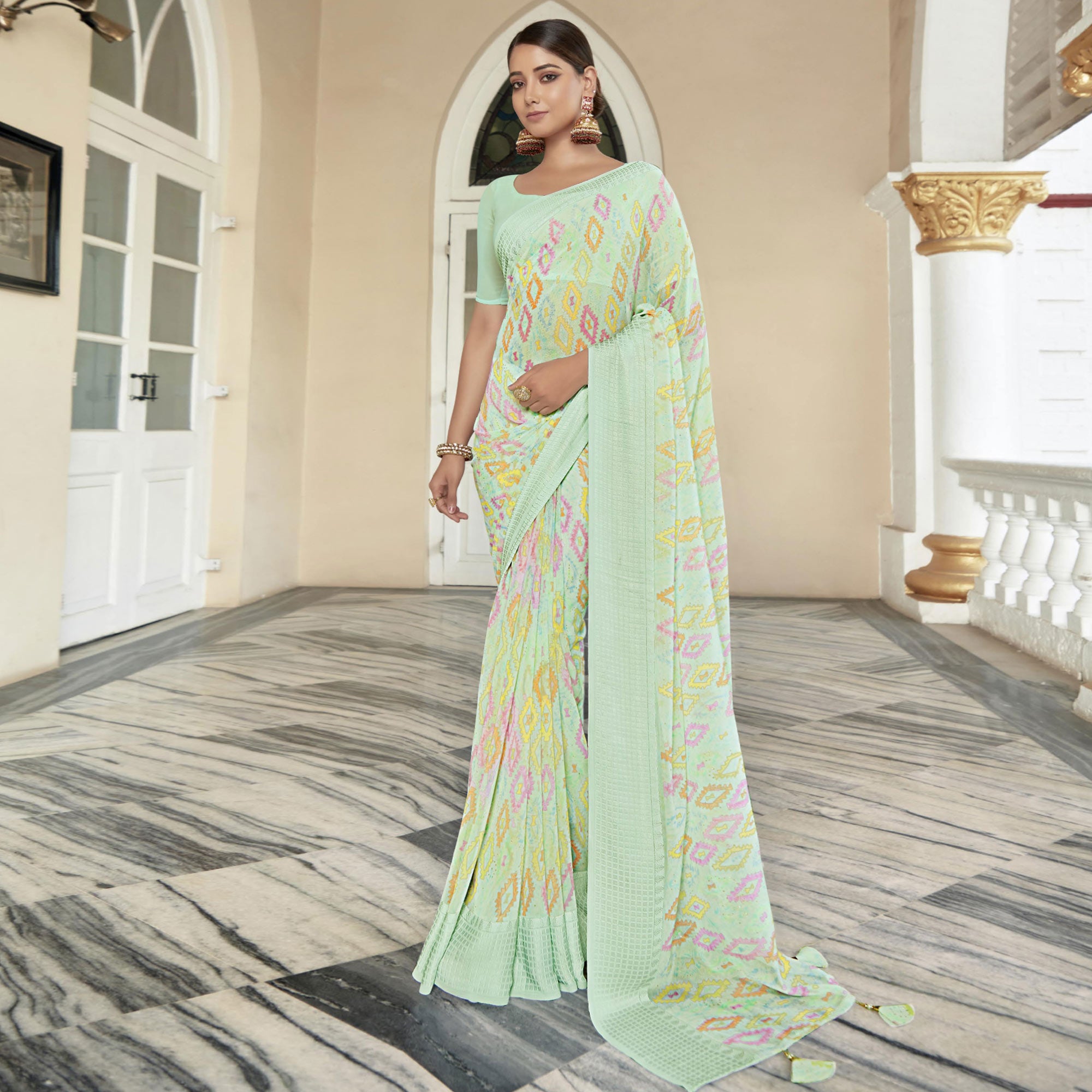 Sea Green Printed Georgette Saree With Checks Border