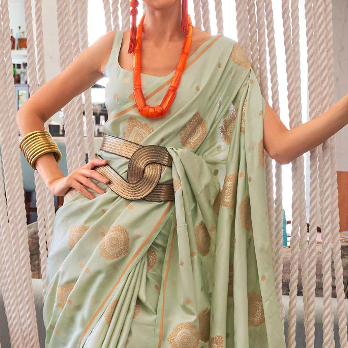 Pista Green Woven Satin Saree With Tassels