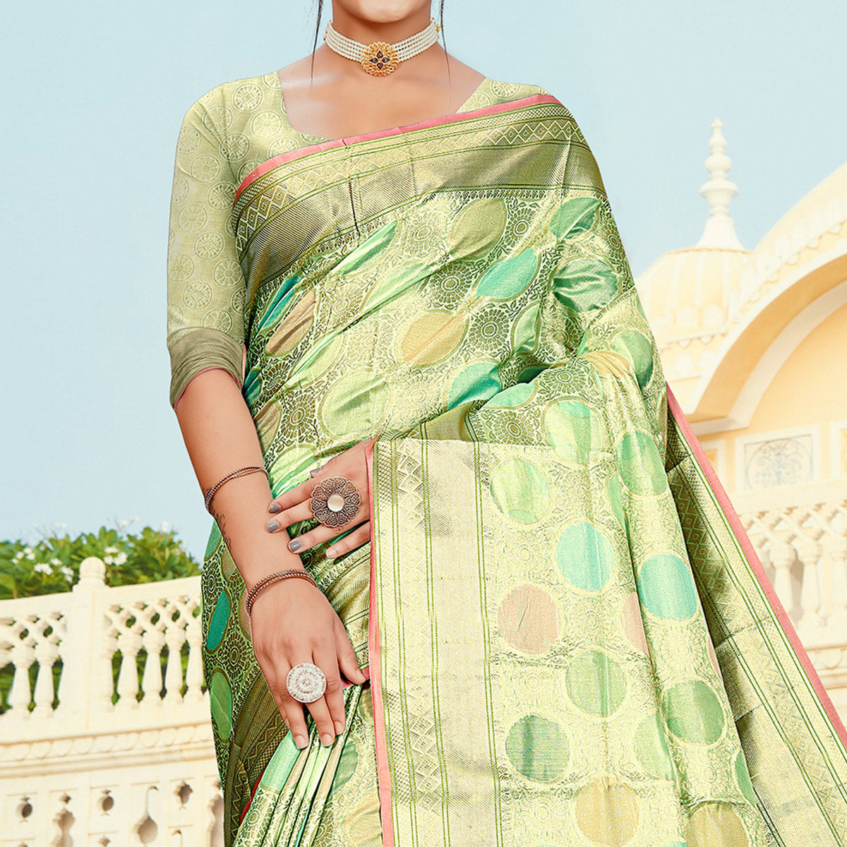 Pista Green Floral Woven Organza Saree With Tassels