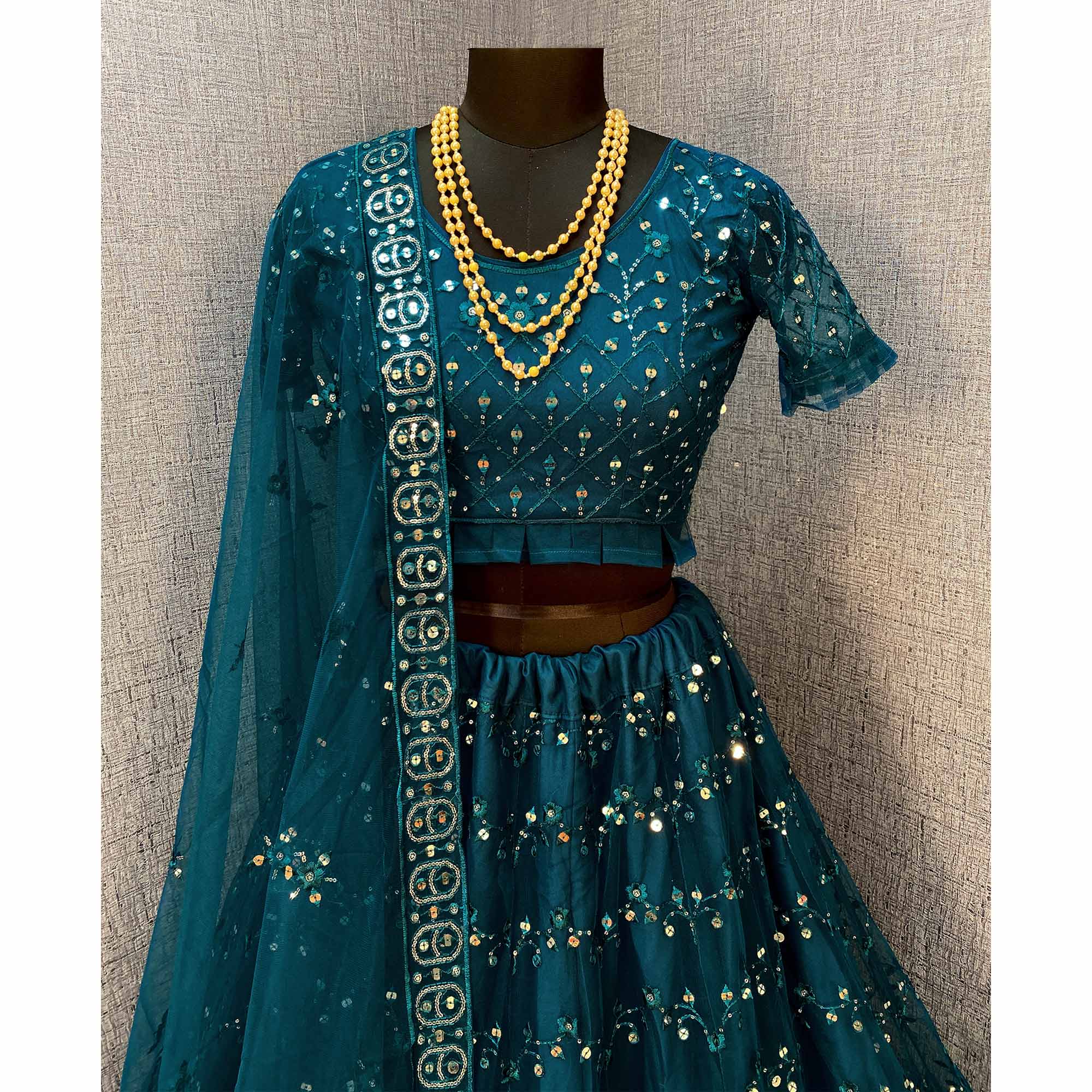 Teal Blue Sequins Embroidered Netted Lehenga Choli