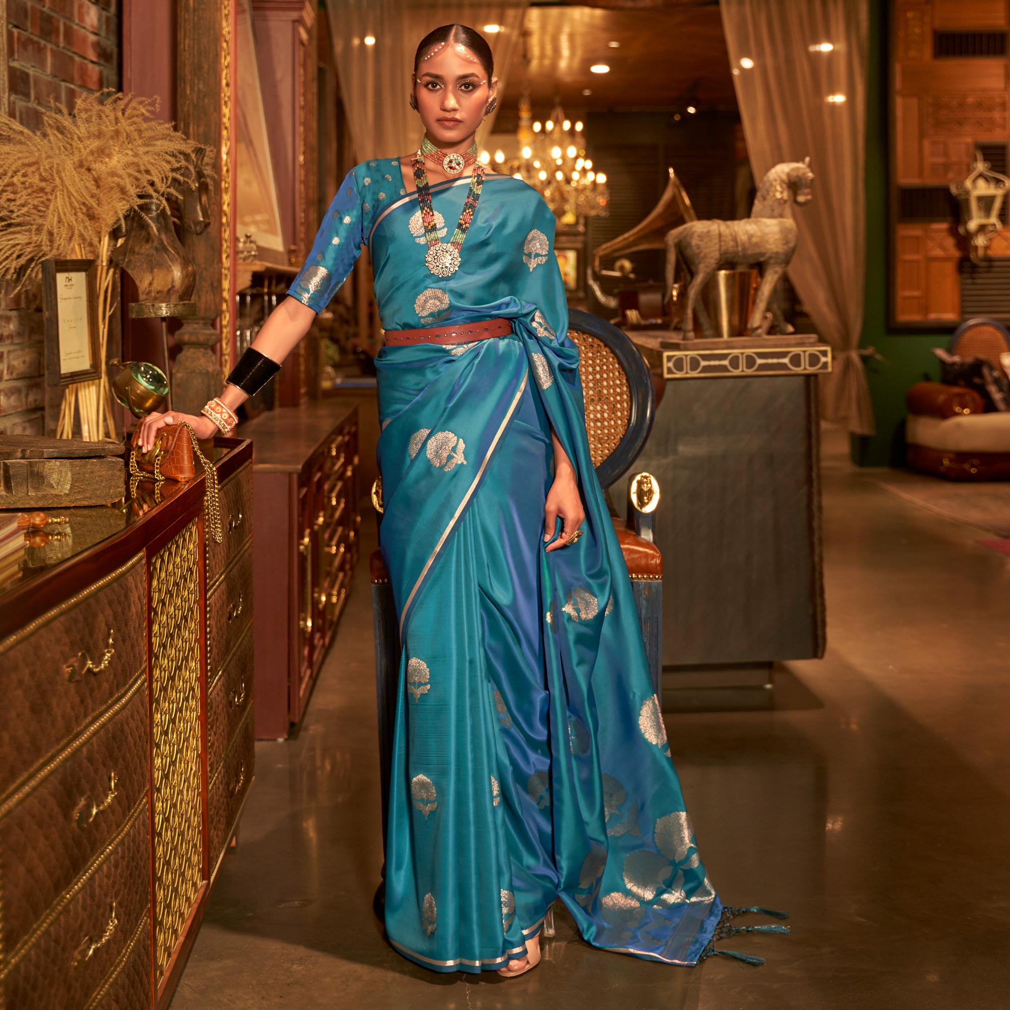 Teal Blue Floral Woven Satin Saree With Tassels