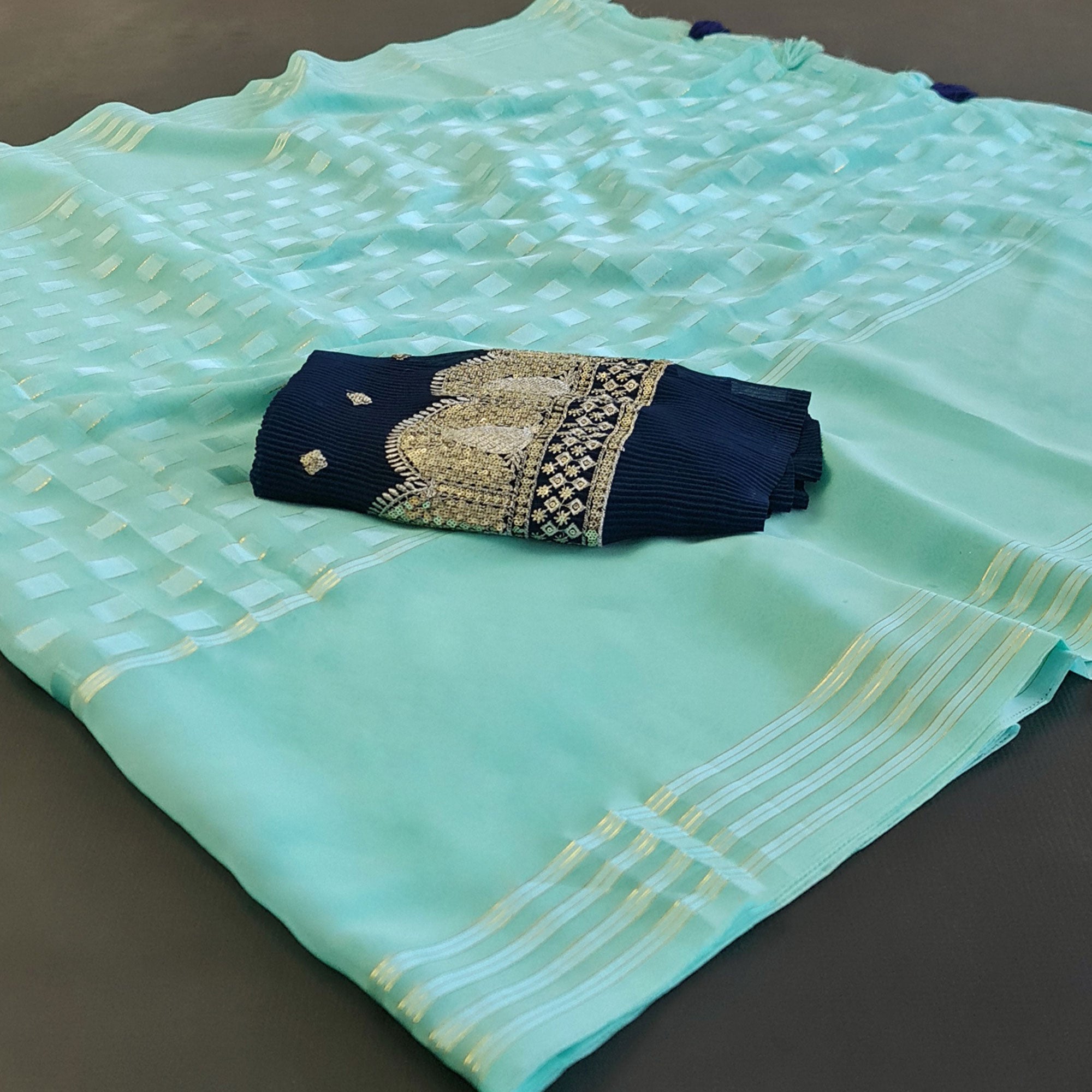 Turquoise Woven Georgette Saree With Tassels