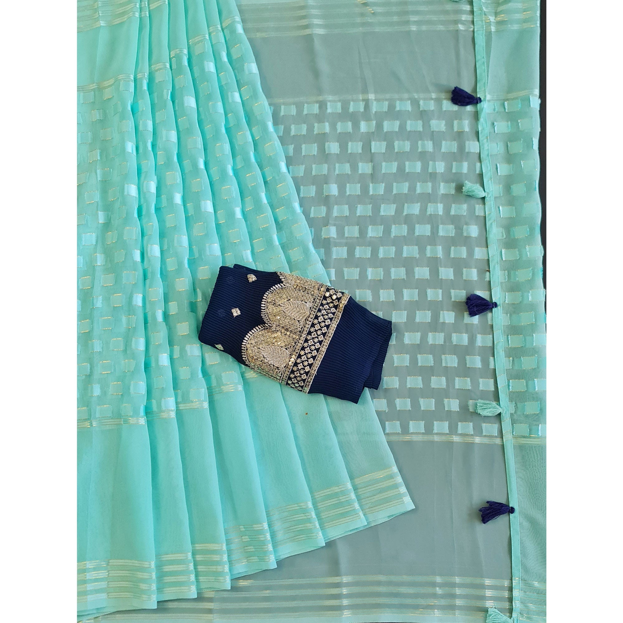 Turquoise Woven Georgette Saree With Tassels