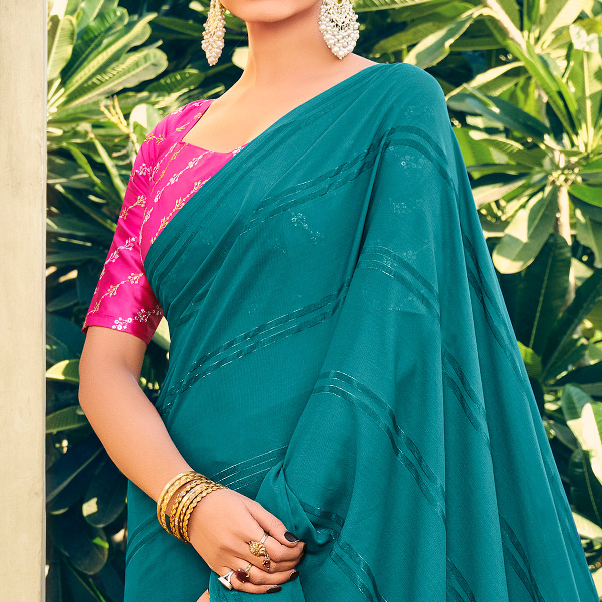 Teal Blue Printed Georgette Saree With Tassels