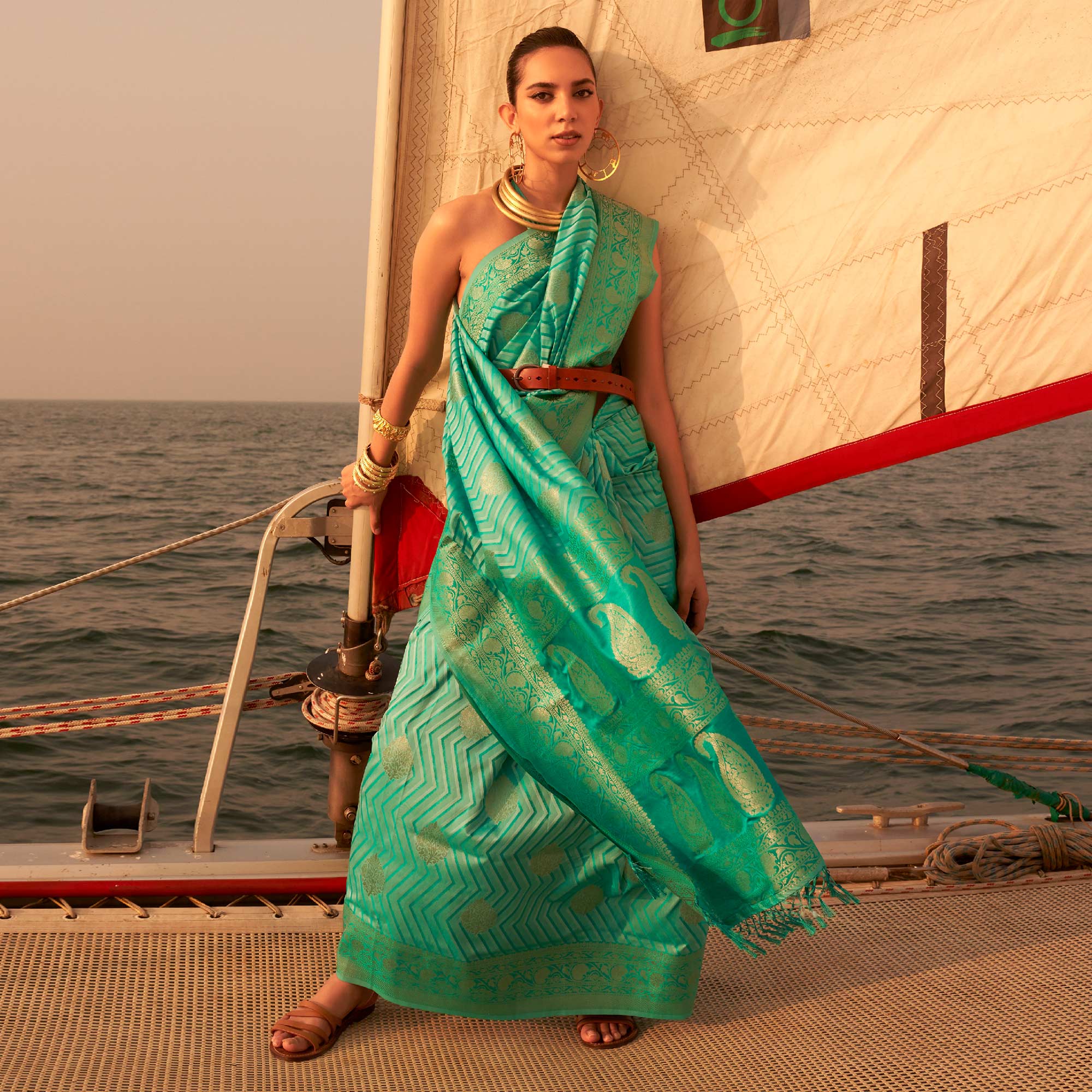 Sea Green Woven Satin Saree With Tassels