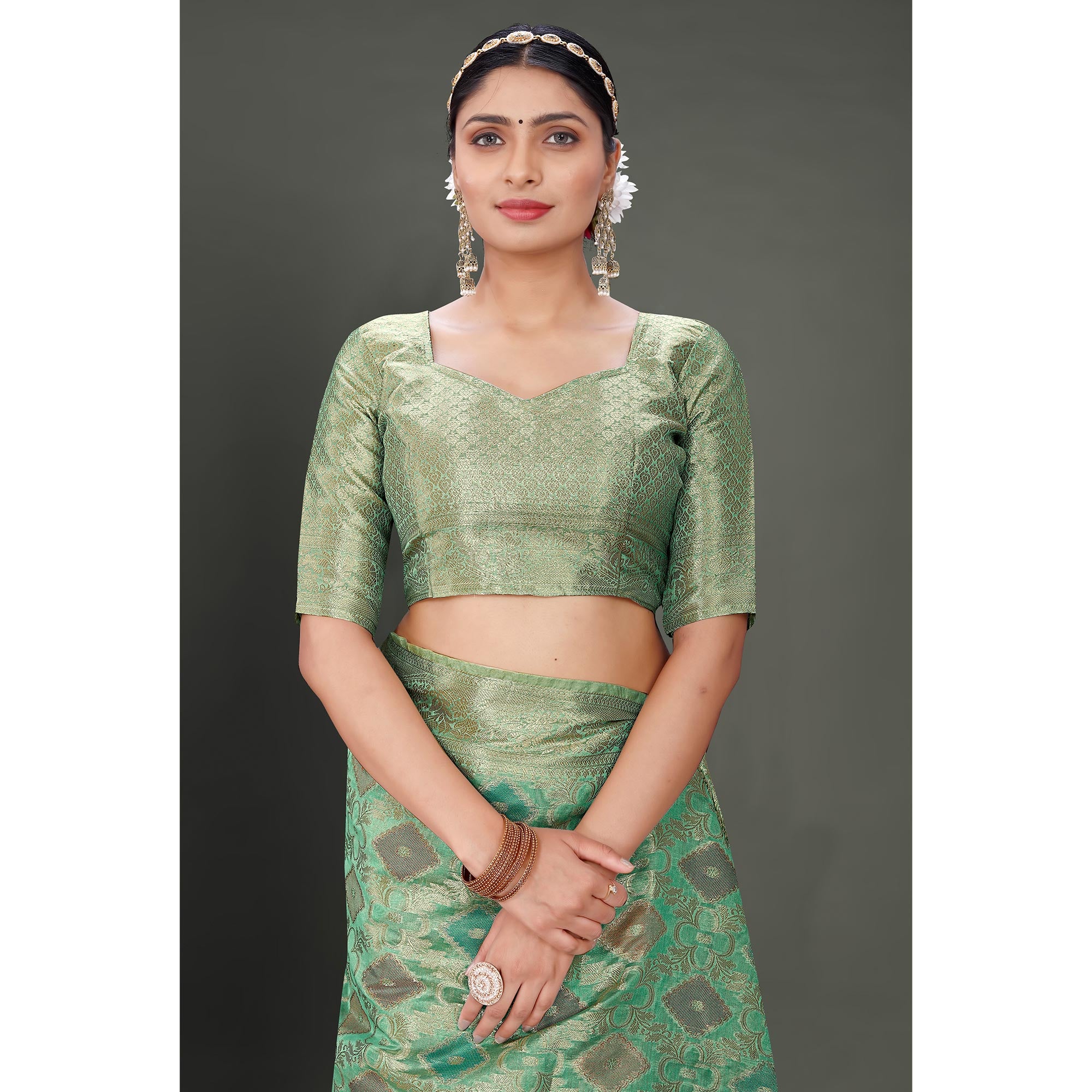 Rama Green Woven Organza Saree With Tassels