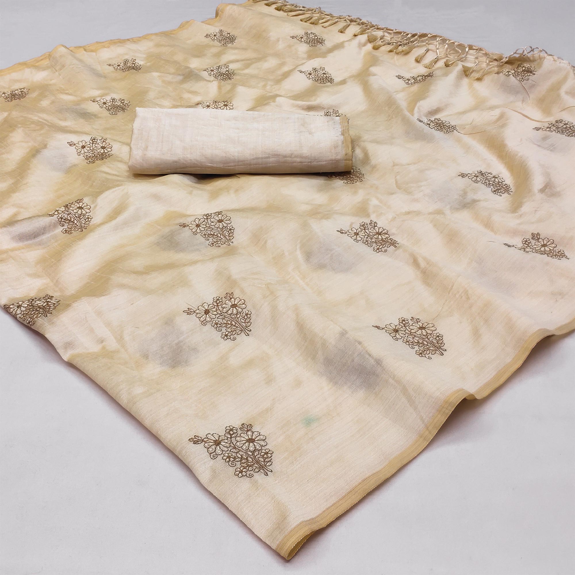 Cream Floral Embroidered Assam Silk Saree With Tassels